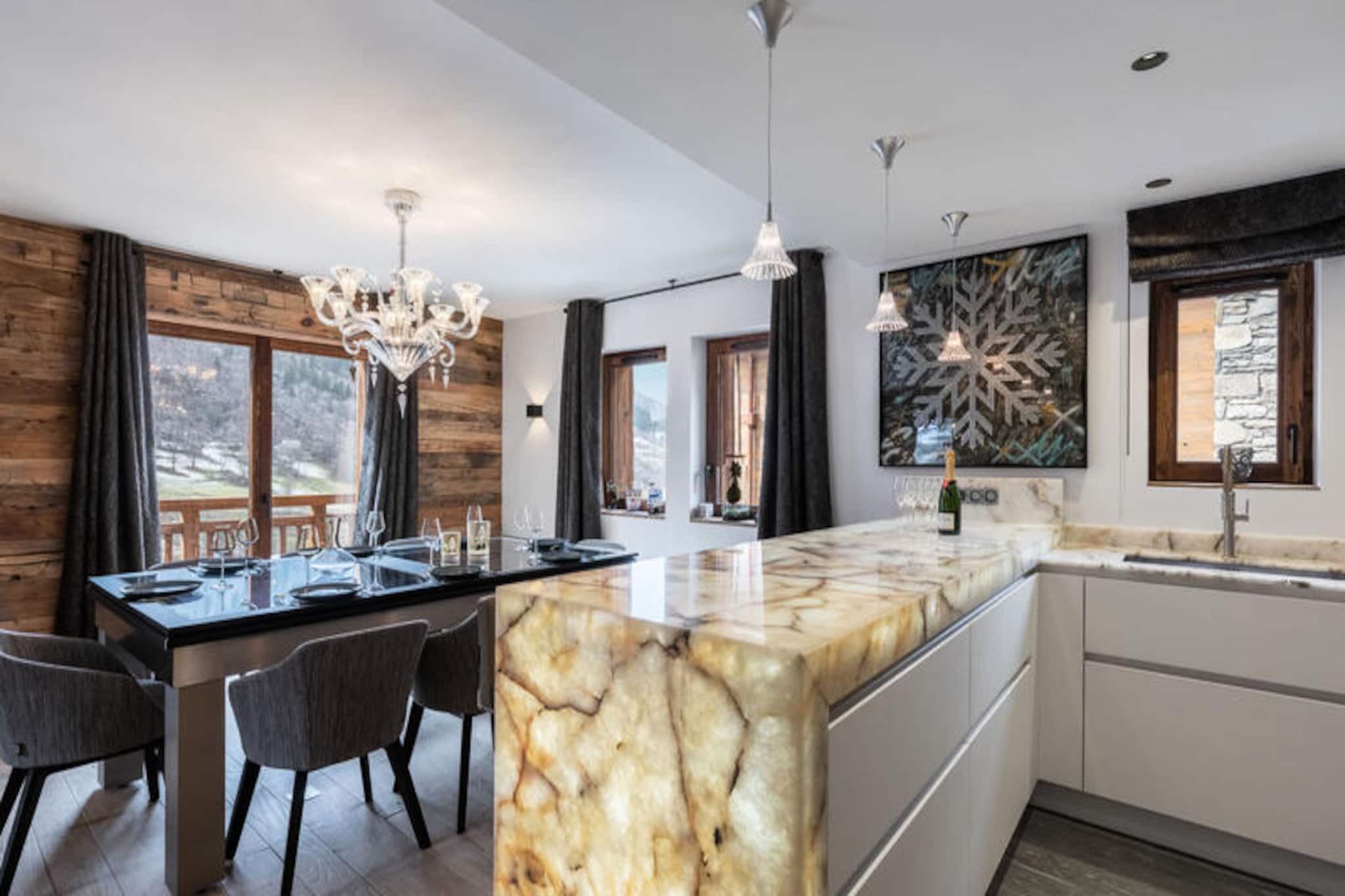 In the picturesque hamlet of La Gittaz, this luxurious 5-star chalet offers an exceptional alpine retreat in the heart of Méribel. Surrounded by breathtaking mountain scenery, the chalet combines traditional Savoyard charm with modern elegance, creating a warm and inviting atmosphere for your holiday. Whether you're here to ski the legendary slopes of the 3 Vallées or simply unwind in serene surroundings, this property promises a memorable escape.
Spanning 184m², the chalet comfortably accommodates up to eight adults across four ensuite bedrooms, each thoughtfully designed for relaxation and privacy. The living area on the first floor features a cozy fireplace, perfect for gathering after a day on the slopes, while the open-plan kitchen is fully equipped with high-end appliances, including a wine cooler and steam oven. Additional amenities include a private elevator, ski lockers with boot dryers, a laundry room, and a two-car garage. Guests also have access to an electric cart for added convenience.
Located just 600m from the Olympe cable car and free shuttle buses, the chalet offers seamless access to La Chaudanne and the ski lesson departure point. Alternatively, head to Méribel Village and take the Golf chairlift to explore the vast 3 Vallées ski area. Free parking is available at the base of the chairlift, making it easy to enjoy the region's world-class skiing and après-ski activities.
With its premium location, outstanding amenities, and thoughtful services—including a champagne welcome, mid-week cleaning, and luxurious linens—this chalet is the perfect choice for those seeking a refined mountain getaway. Let the enchanting beauty of Méribel and the comfort of this exceptional property create unforgettable memories for your alpine adventure.
