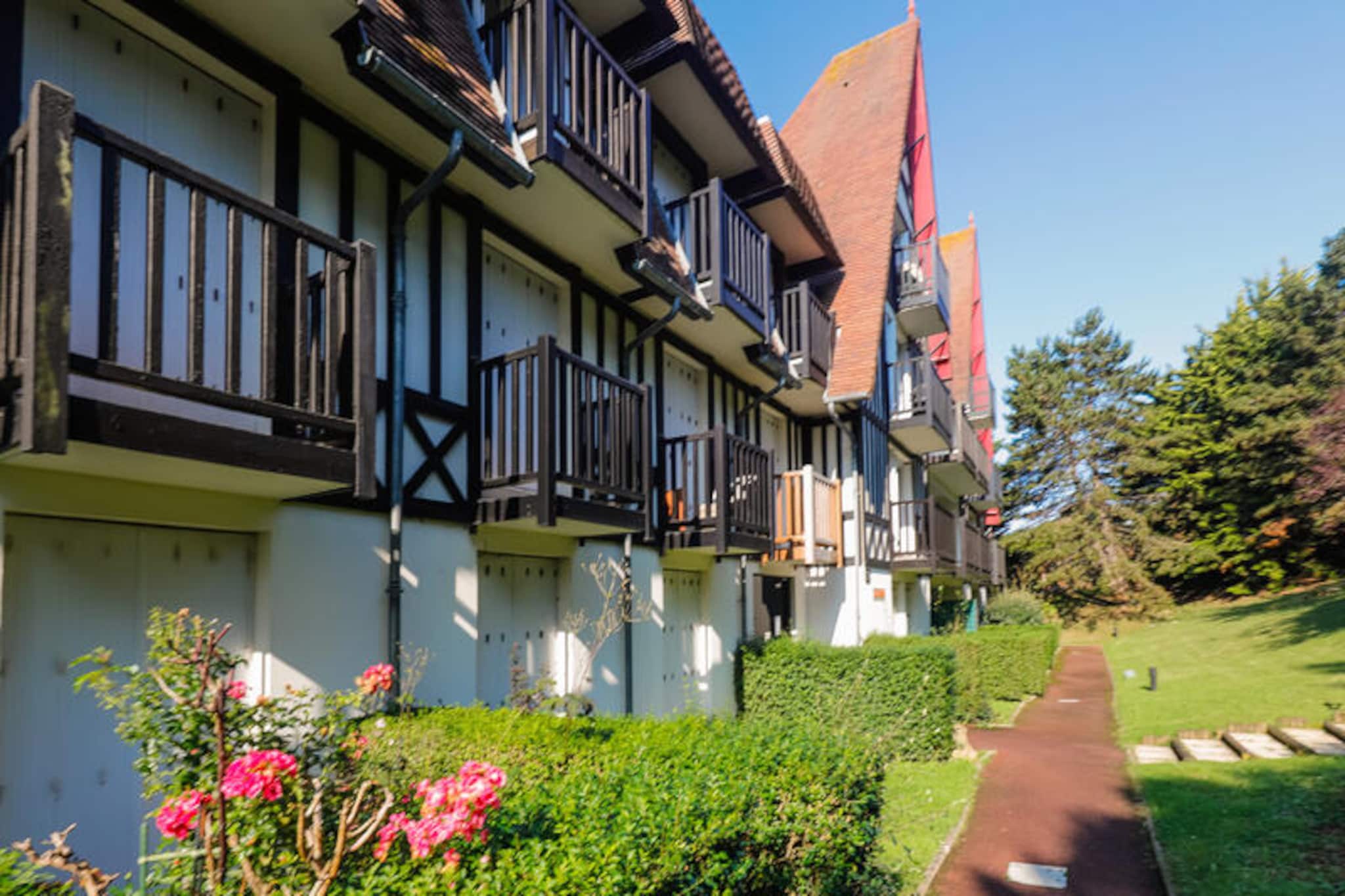 In the charming seaside town of Blonville-sur-Mer, just a short drive from the glamour of Deauville, this delightful second-floor apartment offers a serene escape with a touch of coastal elegance. Imagine waking up to the gentle light streaming through your south-facing balcony, where unobstructed views of the lush valley invite you to start your day with a sense of calm and connection to nature. The beach is just a 10-minute stroll away, making it easy to enjoy the soft sands and refreshing sea breeze whenever you please.
Inside, the apartment is thoughtfully designed to provide both comfort and functionality. The welcoming living room, complete with a cozy sofa and TV, is perfect for unwinding after a day of exploration. The semi-open kitchen is fully equipped with modern amenities, including a refrigerator, electric stovetop, microwave, Nespresso machine, toaster, and kettle, ensuring you have everything you need to prepare delicious meals. The bedroom features a comfortable double bed, while the bathroom offers a relaxing bathtub for a soothing soak. Wi-Fi is included, making it easy to stay connected during your stay.
Blonville-sur-Mer’s central location means you’re within walking distance of local shops and restaurants, adding convenience to your holiday experience. Whether you’re exploring the vibrant streets of Deauville, enjoying the nearby beach, or simply savoring the tranquil views from your balcony, this apartment serves as the perfect base for your Normandy getaway. With its blend of modern comfort and idyllic surroundings, it’s a place where cherished memories are made.