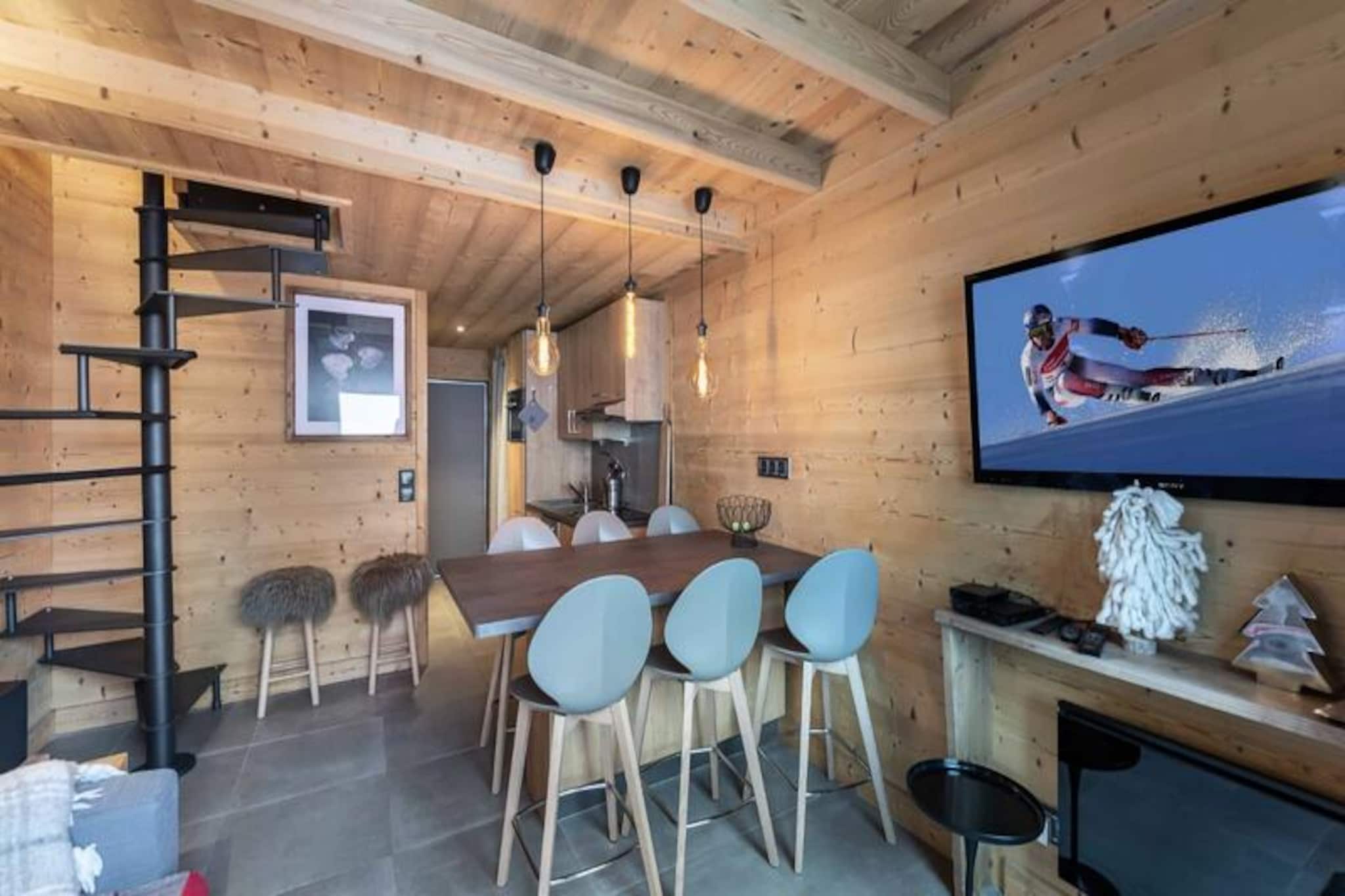 At the heart of the vibrant Val Thorens resort, this charming duplex apartment offers a cozy alpine retreat for up to six guests. Perfectly situated near the slopes and local shops, it invites you to immerse yourself in the dynamic energy of one of the world’s most renowned ski destinations. Picture yourself waking up to crisp mountain air, stepping onto your private balcony, and planning a day filled with thrilling adventures in the snowy paradise that surrounds you. Whether you’re here for skiing, snowboarding, or simply enjoying the breathtaking views, this residence is your gateway to unforgettable memories. \n\nThe apartment spans 41 square meters across two levels, thoughtfully designed for comfort and convenience. On the lower level, you’ll find an inviting open-plan living room with a fully equipped kitchen, perfect for preparing hearty meals after a day on the slopes. A bathroom with a bathtub and a separate WC complete the layout. Upstairs, two cozy double bedrooms and a mountain corner with bunk beds provide restful sleeping arrangements for families or groups of friends. Additional amenities include ski lockers on level -1, ensuring easy storage for your gear.\n\nBeyond the apartment, Val Thorens offers endless opportunities for exploration and excitement. From world-class ski slopes to lively après-ski venues, everything you need is just steps away. In summer, the resort transforms into a haven for hikers and mountain bikers, with trails leading to stunning alpine vistas. Local shops, restaurants, and cultural events add to the charm, making this destination a year-round favorite.\n\nWhether you’re seeking adventure or relaxation, this duplex apartment combines comfort, convenience, and an unbeatable location to create the perfect alpine escape. Let the magic of Val Thorens captivate you and make your holiday truly extraordinary.