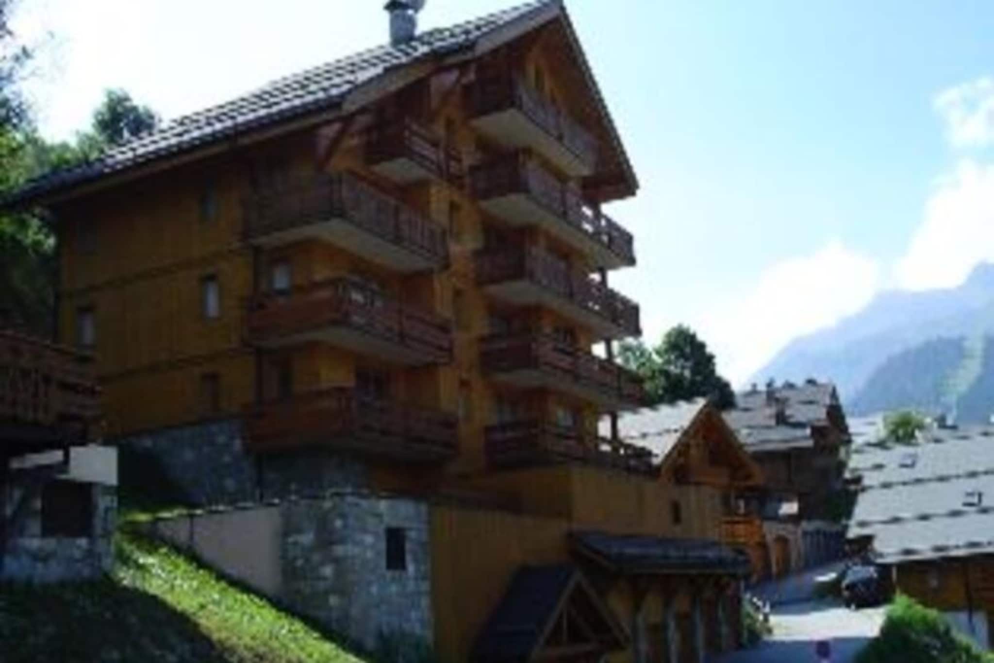 High above the shimmering valley of Méribel, this delightful apartment offers a serene retreat with breathtaking views of the resort and surrounding alpine landscapes. Whether you're visiting for a winter ski adventure or a summer escape, the southwest-facing terrace invites you to soak in the beauty of the French Alps as the sun sets over the peaks. Located in the peaceful Plan du Moulin district, the residence is just a 10-minute walk from the heart of Méribel, with its charming shops, restaurants, and lively atmosphere. A nearby shuttle stop ensures easy access to the slopes and village center, making your stay both convenient and relaxing. \n\nInside, the apartment combines comfort and functionality, boasting a 3-star rating and the prestigious Méribel Label. The 45m² space accommodates up to four guests, featuring a cozy living room with a double sofa bed and a tranquil bedroom with a double bed. The fully equipped kitchen includes a ceramic hob, oven, microwave, dishwasher, and refrigerator, perfect for preparing hearty meals after a day of alpine adventures. The bathroom is a haven of relaxation, complete with a hydromassage bathtub, while additional amenities such as Wi-Fi, a television, and a DVD player ensure entertainment and connectivity throughout your stay. \n\nStep outside to enjoy the garden furniture on the terrace or store your ski gear in the dedicated locker. Pets are welcome, and bed linen and towels are included for most stays, adding to the convenience. Méribel’s vibrant village center, ski slopes, and summer trails are all within easy reach, offering endless opportunities for exploration and enjoyment. \n\nWhether you’re carving through pristine snow, hiking scenic trails, or simply unwinding in the comfort of this charming apartment, Méribel promises unforgettable memories in the heart of the French Alps.