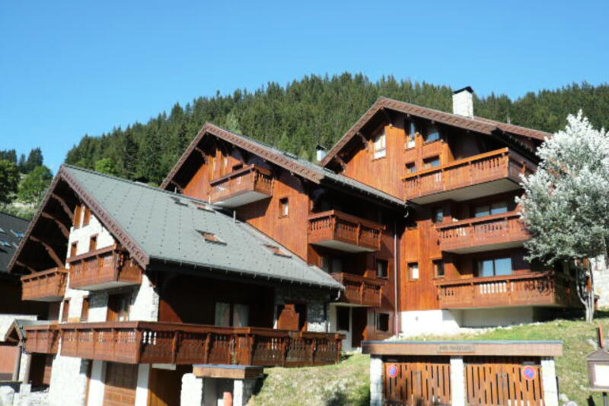High above the enchanting slopes of Méribel-Morel, this beautifully renovated alpine apartment invites you to experience the magic of the French Alps in style and comfort. With its prime location just minutes from the Morel chairlift, you’ll find yourself effortlessly transported to the Altiport snow front, ready to explore the pristine pistes of this world-renowned ski destination. The apartment’s expansive bay windows flood the living space with natural light, offering breathtaking views of the snowy landscape and a seamless connection to the outdoors from your private balcony. Whether you’re here for winter sports or summer hiking, this residence is your gateway to unforgettable alpine adventures. \n\nSpanning 59m², the apartment is thoughtfully designed to accommodate up to six guests across three cozy bedrooms. The master bedroom features a plush double bed, while the second bedroom offers two comfortable single beds. The third bedroom, with its bunk beds, is perfect for younger travelers, though the upper bunk is not suitable for children under six. Two modern bathrooms, including one with a shower, ensure convenience for all guests. Additional amenities such as TVs in the double bedrooms, a ski locker, and a covered parking space enhance your stay, while the option to rent a Wi-Fi router keeps you connected during your holiday. \n\nLocated in the charming Morel district, you’re just a short stroll from local shops and restaurants, making it easy to enjoy Méribel’s vibrant après-ski scene or indulge in Savoyard specialties. The resort center is a mere 10-minute walk away, offering even more dining, shopping, and entertainment options. For summer visitors, the surrounding trails and mountain vistas transform the area into a haven for hikers and nature lovers. \n\nWhether you’re seeking thrilling days on the slopes or tranquil evenings by the fire, this Méribel-Morel apartment combines luxury, convenience, and unbeatable access to the best of the Alps. Make it your home away from home and create memories that will last a lifetime.
