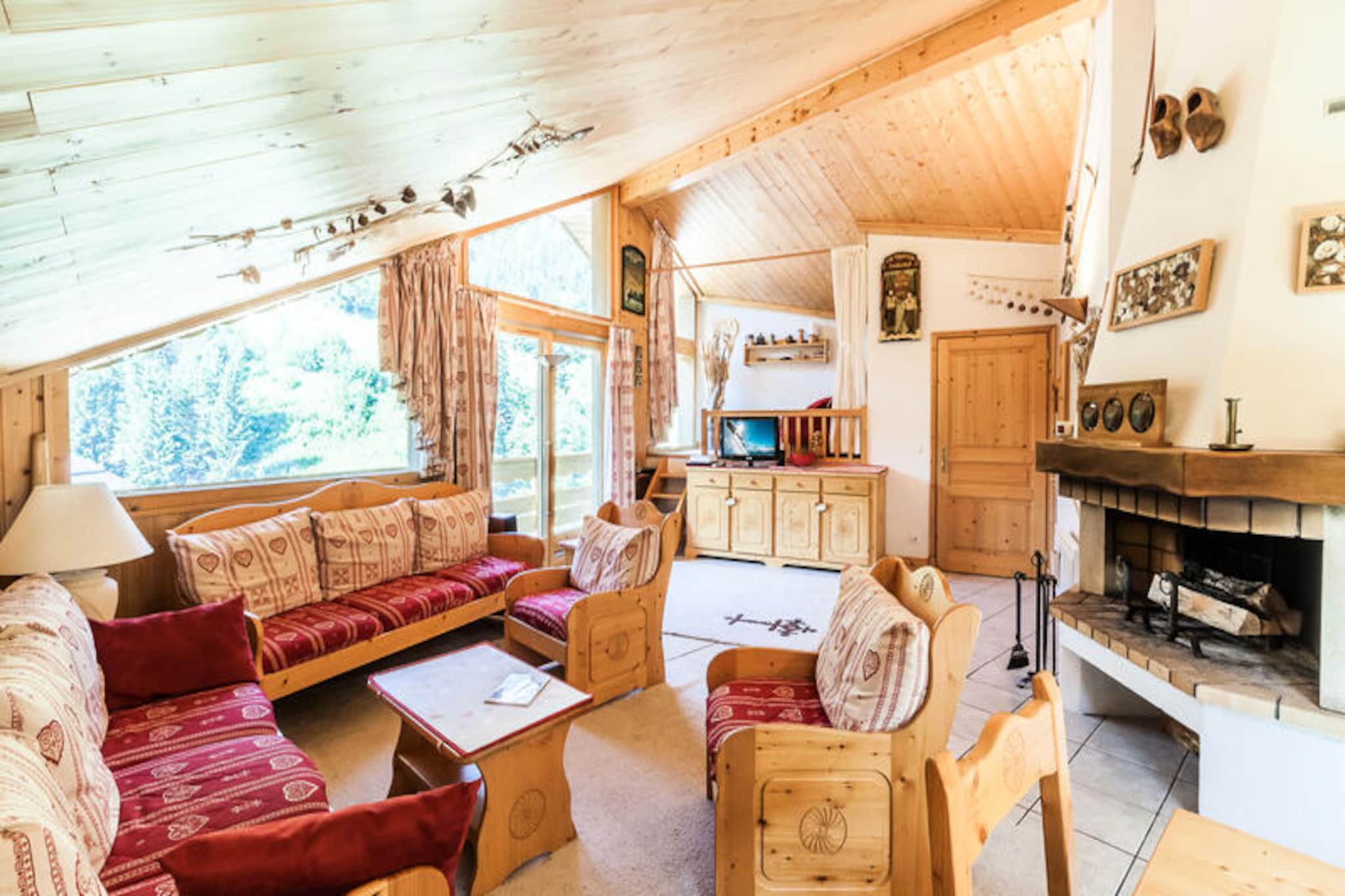 High above the enchanting valley of Méribel, this spacious alpine retreat invites you to experience the magic of the French Alps in every season. With panoramic views of snow-dusted peaks and the lively snow front, this 100m² apartment combines comfort and charm, offering an unforgettable escape for families and groups seeking the perfect blend of adventure and relaxation. The residence is ideally situated in La Chaudanne, at the foot of the slopes and mere steps from the ski lifts, ski school, daycare, and shuttle bus stop, ensuring effortless access to the heart of Méribel’s world-class skiing domain. \n\nInside, the apartment boasts a cozy yet elegant alpine-inspired décor. The open-plan living room, bathed in natural light, features a welcoming sofa area with a TV and a dining table for six, perfect for sharing meals and stories after a day on the slopes. The fully equipped kitchen includes electric hobs, a combination oven/microwave, a dishwasher, and a refrigerator, making it easy to prepare hearty mountain meals. With three bedrooms—two offering flexible twin beds and one with a double bed—plus two bathrooms and a separate toilet, the layout ensures comfort and privacy for all guests. Additional amenities include a fireplace for cozy evenings, a ski locker, and a covered parking space. \n\nBeyond the apartment, Méribel’s vibrant village life awaits. From charming restaurants serving Savoyard specialties to boutique shops and après-ski hotspots, everything is within reach. In summer, the valley transforms into a haven for hikers, cyclists, and nature lovers, with trails winding through lush meadows and alpine forests. Whether you’re carving down pristine slopes or exploring the breathtaking landscapes of the Trois Vallées, this residence offers the perfect base for your alpine adventure. Let the allure of Méribel captivate you and create memories that will last a lifetime.