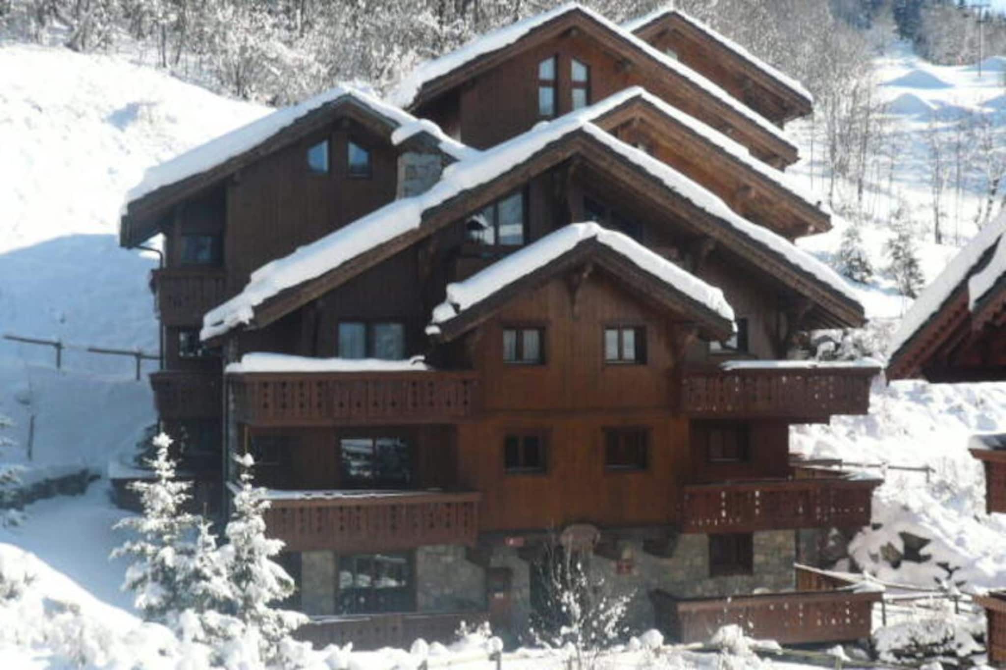 High above the enchanting Méribel Village, this charming 2-bedroom apartment offers a perfect retreat for both winter and summer holidays. Imagine waking up to the breathtaking views of snow-dusted peaks and sunlit slopes from your southwest-facing balcony, where the serene alpine landscape sets the tone for your day. Located at the foot of the slopes, this residence combines the convenience of ski-in/ski-out access with the charm of a traditional mountain village, complete with local shops and a free shuttle service to the bustling center of Méribel just 2 km away.
Step inside this 43m² apartment, awarded the prestigious 3-star Méribel Label, and discover a cozy yet functional space designed to accommodate up to six guests. The living room features a comfortable sofa bed and pull-out bed, while the two bedrooms provide restful sleeping arrangements, including a double bed with an en-suite shower and two single beds. The open-plan kitchen is fully equipped with modern appliances, making it easy to prepare hearty meals after a day on the slopes. Additional amenities such as a flat-screen TV, Wi-Fi access, a washing machine, and a ski locker ensure a hassle-free stay.
Guests also enjoy access to the indoor pool located in the neighboring building, perfect for unwinding after an active day. Whether you're skiing in the winter or hiking and biking in the summer, the surrounding area offers endless opportunities for adventure. With its prime location, stunning views, and thoughtful amenities, this Méribel Village apartment promises an unforgettable alpine escape for families and friends alike.