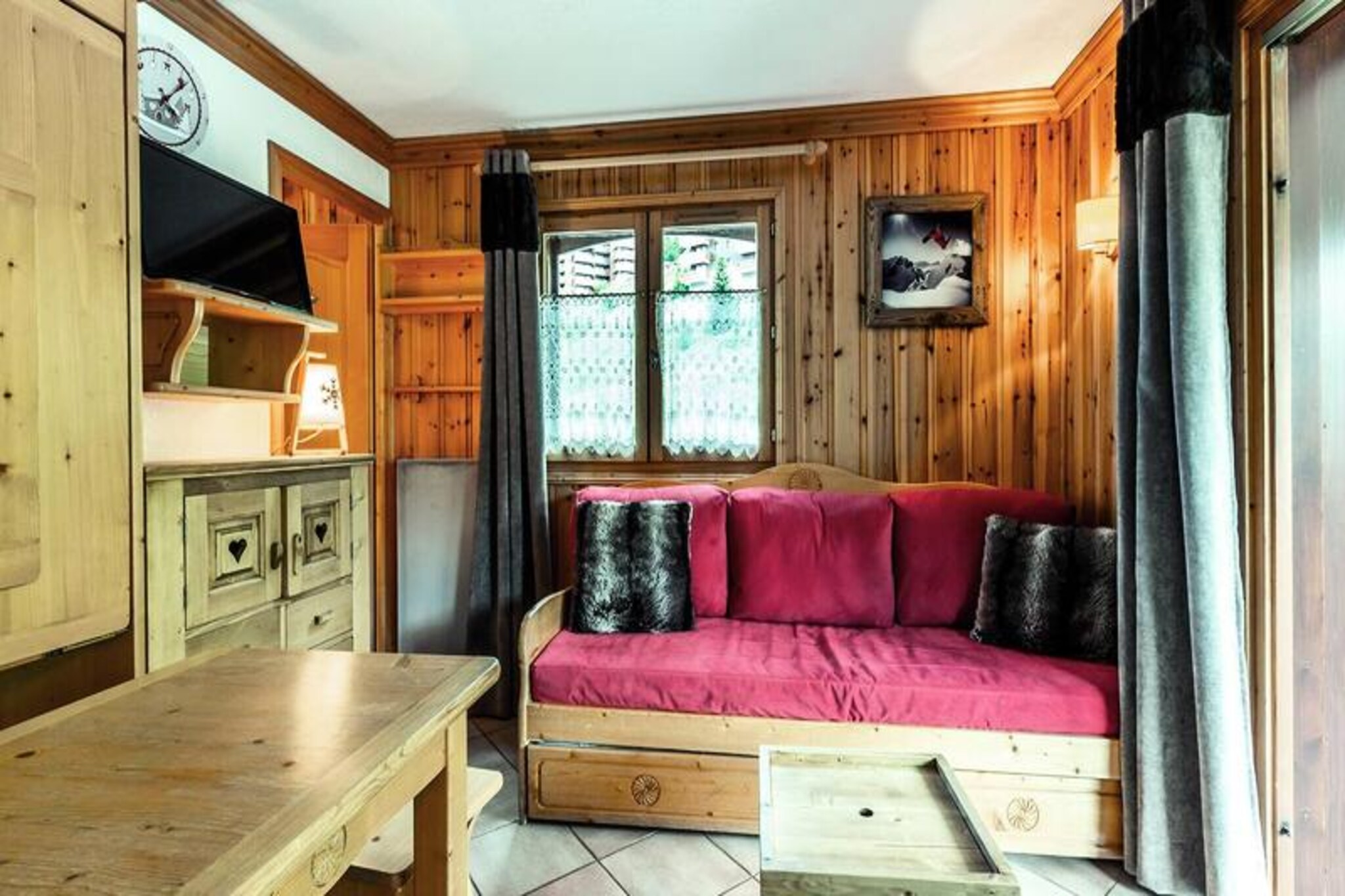 In the serene and picturesque neighborhood of Le Chatelet in Méribel Mottaret, this charming apartment offers a perfect retreat for mountain lovers. Surrounded by the breathtaking beauty of the French Alps and just a short walk from the tranquil Lake Tueda, this property is ideal for those seeking both adventure and relaxation in a peaceful alpine setting. Whether you're planning a winter escape to the slopes or a summer getaway to explore the trails, this residence is your gateway to nature's wonders. \n\nThe apartment is thoughtfully designed to accommodate up to six guests comfortably. The living room features a cozy sofa bed, a trundle bed, and a television, creating a welcoming space for relaxation after a day of activities. The bedroom with a double bed and a sleeping alcove with bunk beds ensure restful nights for everyone. The fully equipped kitchen, complete with a ceramic hob, dishwasher, microwave, oven, and coffee maker, makes meal preparation a breeze. A private balcony invites you to soak in the fresh mountain air, while the bathroom with a bathtub and separate toilet adds convenience. Additional amenities include a ski locker and optional services such as linens, towels, and end-of-stay cleaning.\n\nThe residence, Les Alpages, is a modern complex of five independent chalets, offering easy access to the ski slopes and lifts on foot. Shops are conveniently located within 150 to 400 meters, and the quiet surroundings make it a haven for walkers, snowshoers, and cross-country skiers. With its proximity to Lake Tueda and the charm of Méribel Mottaret, this apartment is an excellent choice for a memorable alpine holiday. Book your stay now and immerse yourself in the magic of the French Alps.