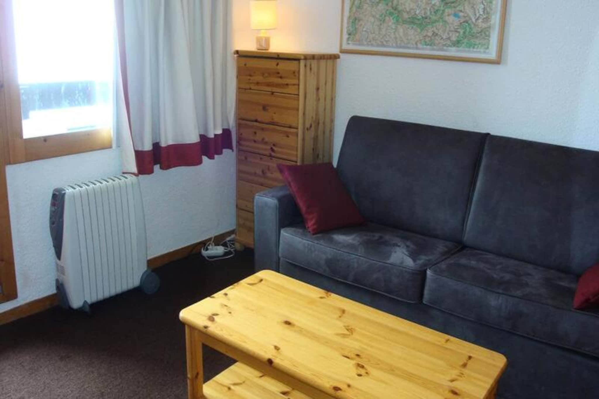 At the edge of the serene Laitelet district in Méribel-Mottaret, this charming apartment invites you to experience the perfect alpine getaway. Located just five minutes from the Furet slope, which connects directly to the heart of the resort, this residence offers a seamless blend of convenience and tranquility. Whether you’re here for thrilling winter sports or peaceful summer hikes, the surrounding landscapes promise unforgettable moments in the French Alps. \n\nInside, the apartment is thoughtfully designed for comfort and practicality. The divisible living room features a single bed, a pull-out bed, and a sofa bed, providing flexible sleeping arrangements for up to four guests. The kitchen is fully equipped with modern appliances, including a hob, dishwasher, combi oven, refrigerator, toaster, kettle, and coffee maker, making meal preparation a breeze. A bathroom with a bathtub and a separate toilet ensures privacy and convenience, while amenities like a television, ski locker, and elevator enhance your stay. Additional services such as linens, towels, and cleaning can be reserved in advance, ensuring a hassle-free experience. \n\nThe Aiguille du Fruit residence is perfectly situated for exploring Méribel-Mottaret. With easy access via the Les Chalets cable car or free shuttles, the resort center is just a 15-minute walk away. In winter, enjoy direct access to the world-class ski slopes, while summer transforms the area into a haven for hiking, cycling, and wildlife spotting. Nearby, you’ll find charming restaurants, shops, and après-ski options that bring the village to life. \n\nWhether you’re seeking adventure on the slopes or relaxation amidst stunning mountain vistas, this apartment offers the ideal base for your alpine escape. Let the beauty of Méribel-Mottaret inspire your next holiday adventure.
