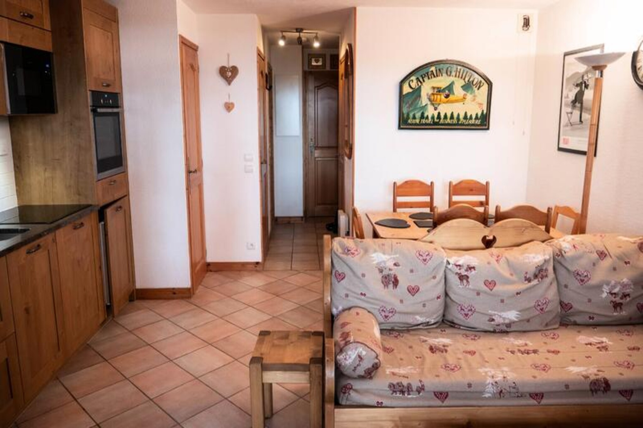 In the serene alpine enclave of Méribel Mottaret, this charming ground-floor apartment offers a cozy retreat for mountain enthusiasts. Situated in the modern La Résidence des Alpages, a collection of five independent chalets, the property is perfectly positioned for easy access to the slopes and ski lifts, just a short walk away. With its northwest-facing balcony, you can unwind while soaking in the tranquil views of the surrounding peaks and forests, creating a perfect blend of comfort and nature. \n\nInside, the apartment is thoughtfully designed to accommodate up to six guests. The living room features a sofa bed, trundle bed, TV, and DVD player, creating a welcoming space to relax after a day of adventure. The main bedroom boasts a comfortable double bed, while the cabin bedroom offers a loft bed and single bed, making it ideal for families or small groups. The fully equipped kitchen includes an electric hob, oven, dishwasher, and refrigerator, ensuring you have everything needed to prepare hearty meals. A bathroom, separate toilet, and ski locker add to the convenience, while the non-smoking and pet-free policy ensures a clean and peaceful environment.\n\nNestled in the quiet Le Châtelet neighborhood, the apartment is just 150 to 400 meters from local shops and amenities. The proximity to Lake Tueda makes it a fantastic base for walkers, snowshoe enthusiasts, and cross-country skiers. In summer, the area transforms into a haven for hikers and nature lovers, with trails that wind through breathtaking alpine landscapes. \n\nWhether you’re seeking thrilling winter sports or serene summer escapes, this apartment offers an ideal location to experience the magic of the French Alps. Reserve your stay today and create unforgettable memories in Méribel Mottaret.