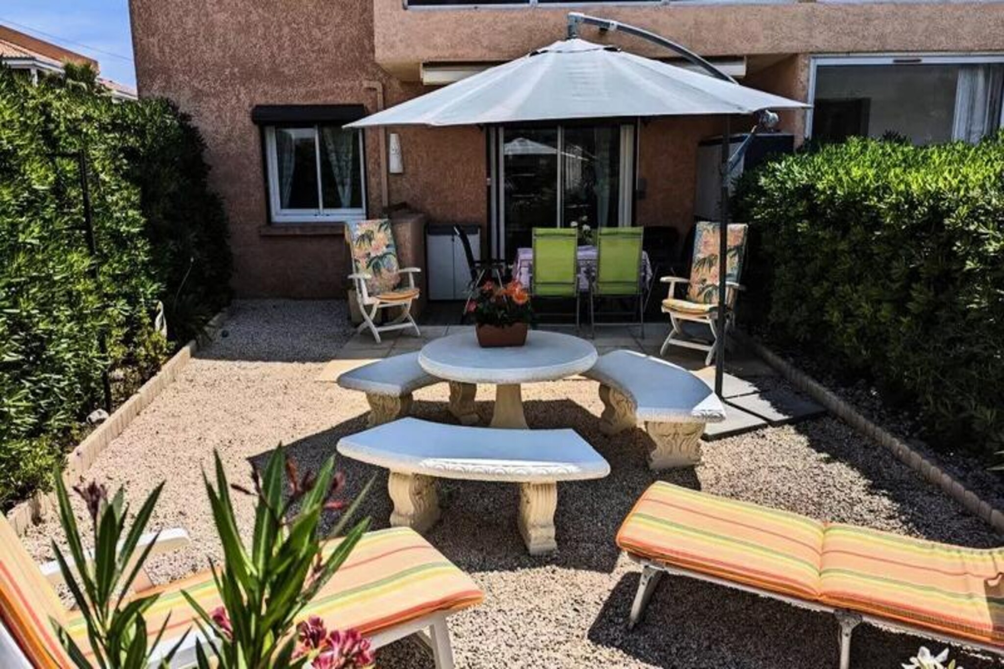 Immerse yourself in the charm of the French Riviera with this delightful apartment in Six-Fours-les-Plages, where sun, sea, and serenity come together. Just a short 350-meter stroll from the golden sands of Bonnegrâce Beach, this property offers the perfect blend of relaxation and adventure. Whether you're seeking tranquil mornings by the sea or exploring the vibrant coastal towns nearby, this is your ideal getaway.
Spanning 70 m², the apartment comfortably accommodates up to four guests. The bright living and dining area opens onto a spacious 60 m² terrace, perfect for al fresco dining or soaking up the Mediterranean sun. The separate, fully equipped kitchen makes meal preparation a breeze, while the two cozy bedrooms—one with a 160cm double bed and the other with a 140cm double bed—ensure restful nights. A modern bathroom with a walk-in shower and a separate toilet add to the convenience. Guests also benefit from shared parking within the residence.
The location is a gateway to some of the region's most iconic destinations. Explore the charming streets of Sanary-sur-Mer, take a boat trip to the Gaou Islands or Les Embiez, or venture further to the stunning Porquerolles and Cassis. Wine enthusiasts will enjoy a visit to Bandol, while history and culture lovers can explore the medieval village of Le Castellet.
With end-of-stay cleaning included and optional services like Wi-Fi and linen kits available, this apartment ensures a hassle-free holiday. Whether you're here to unwind on the beach or discover the treasures of Provence, this property offers a memorable escape for all.