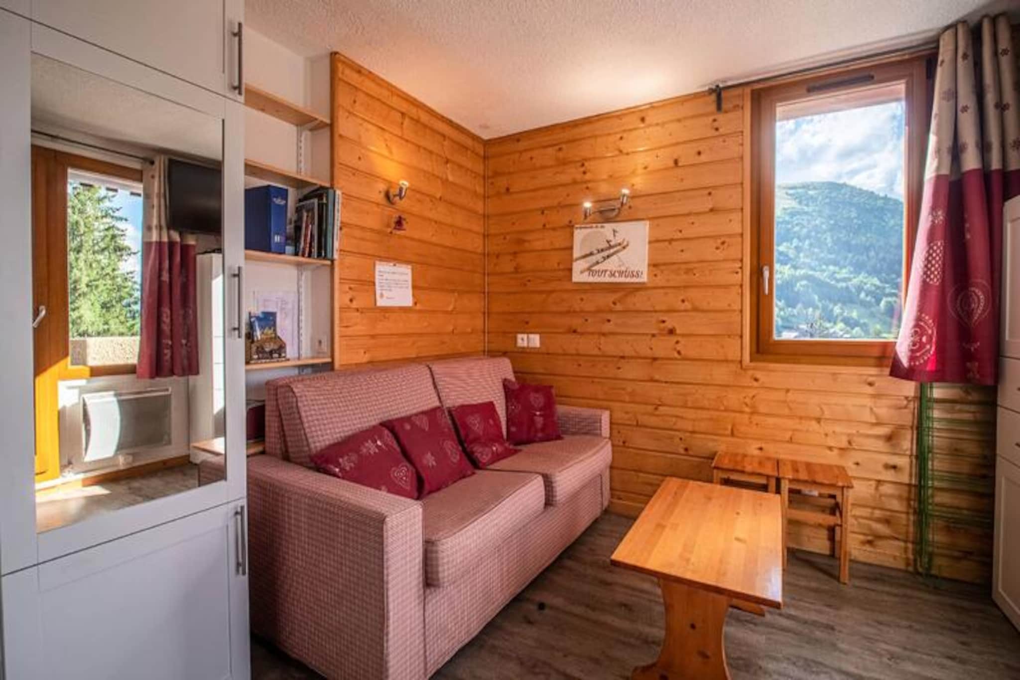 In the heart of the picturesque Crève Coeur hamlet in Valmorel, this charming two-room apartment offers a cozy alpine retreat with unbeatable convenience. Imagine stepping out of your door to find the ski slopes just meters away, with shops and essential amenities close at hand. The southwest-facing balcony provides stunning, unobstructed views of the surrounding mountains, making it the perfect spot to unwind after a day of adventure in the French Alps. Whether you're here for the thrill of skiing or the tranquility of mountain life, this apartment places you at the center of it all. \n\nInside, the apartment is thoughtfully designed for comfort and functionality. The kitchen, opening onto the living room, is equipped with modern appliances including ceramic hobs, a dishwasher, an oven, and a refrigerator, ensuring that preparing meals is a breeze. The living room features a comfortable Rapido sofa bed and a television, creating a welcoming space to relax. A sleeping alcove with a double bed offers a peaceful retreat, while the separate shower room and toilet add convenience. The apartment also includes a ski locker for your gear and car access right in front of the residence, making your stay as seamless as possible.\n\nThe residence, \