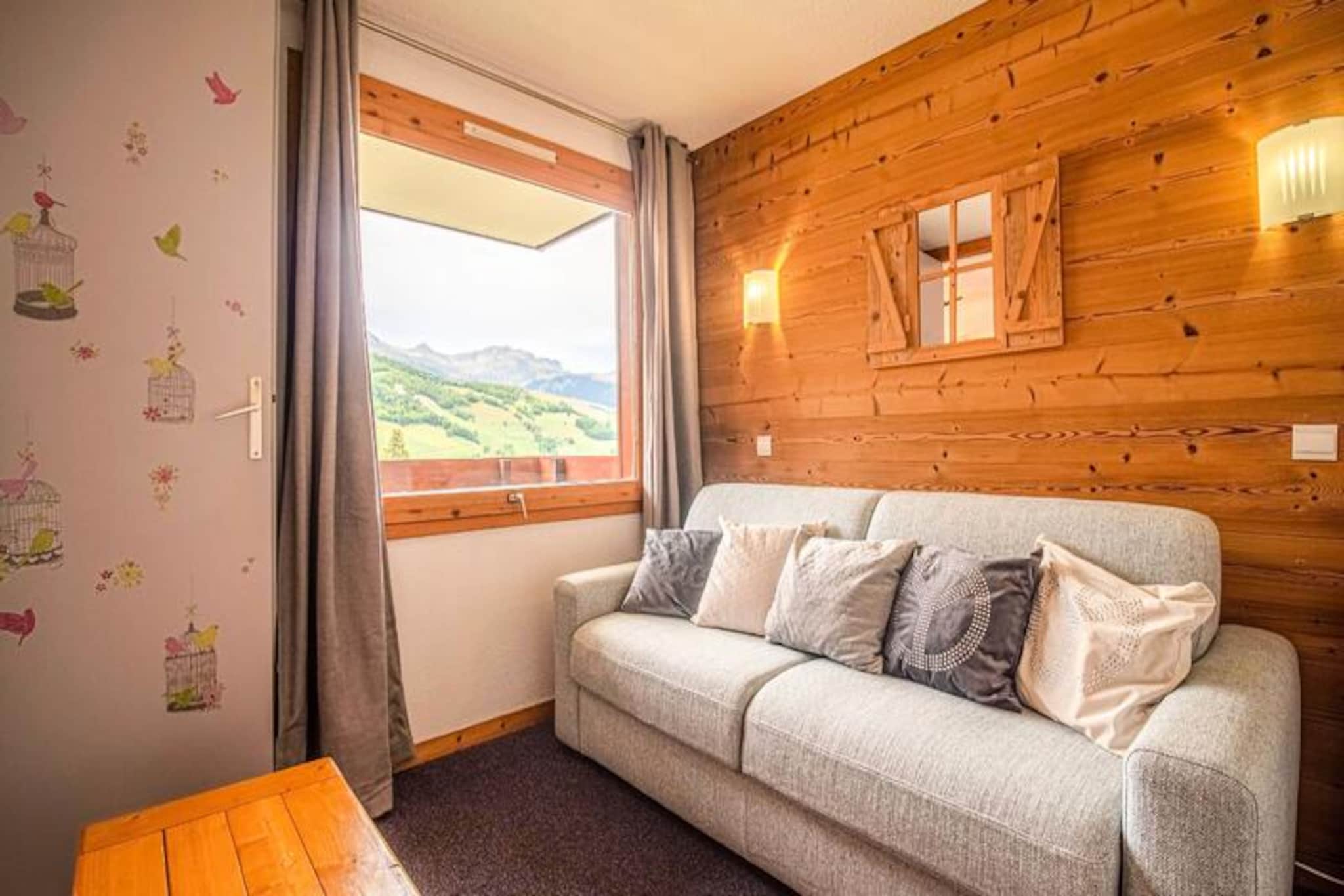 Perched in the serene Crève Coeur neighborhood of Valmorel, this charming studio apartment offers an inviting retreat for ski enthusiasts and nature lovers alike. With ski slopes just 50 meters away and ski lifts 100 meters from your doorstep, you’ll find yourself immersed in the alpine adventure from the moment you arrive. The unobstructed views from the north-west-facing balcony provide a tranquil backdrop for your mornings, as you sip coffee and breathe in the crisp mountain air. The peaceful surroundings and convenient location make this property a perfect base for exploring the beauty of the French Alps. \n\nInside, the apartment is thoughtfully designed for comfort and practicality. The living room features a sofa bed and an additional sofa bed, accommodating up to three guests. The kitchen is equipped with modern amenities, including a ceramic hob, dishwasher, multifunction oven, and refrigerator, making it easy to prepare meals after a day on the slopes. A separate bathroom and toilet add to the convenience, while the ski locker ensures your gear is safely stored. Although Wi-Fi is not included, the cozy ambiance and stunning views more than make up for it. Please note that pets are not allowed, and the apartment is non-smoking. \n\nThe Crève Coeur neighborhood is a hidden gem within Valmorel, offering easy access to essential shops such as a bakery, mini-market, and sports store just 200 meters away. The nearby Pierrafort cable car connects you to the resort center and the hamlet of Mottet, ensuring you’re never far from the action. Paid parking is available right in front of the residence, adding to the convenience for those traveling by car. \n\nWhether you’re here to ski, hike, or simply relax in the breathtaking alpine scenery, this studio provides a welcoming and practical home away from home. With an average guest rating of 8.86/10, it’s clear that this property leaves a lasting impression on all who stay here. Let the magic of Valmorel captivate you as you create unforgettable memories in this idyllic mountain retreat.