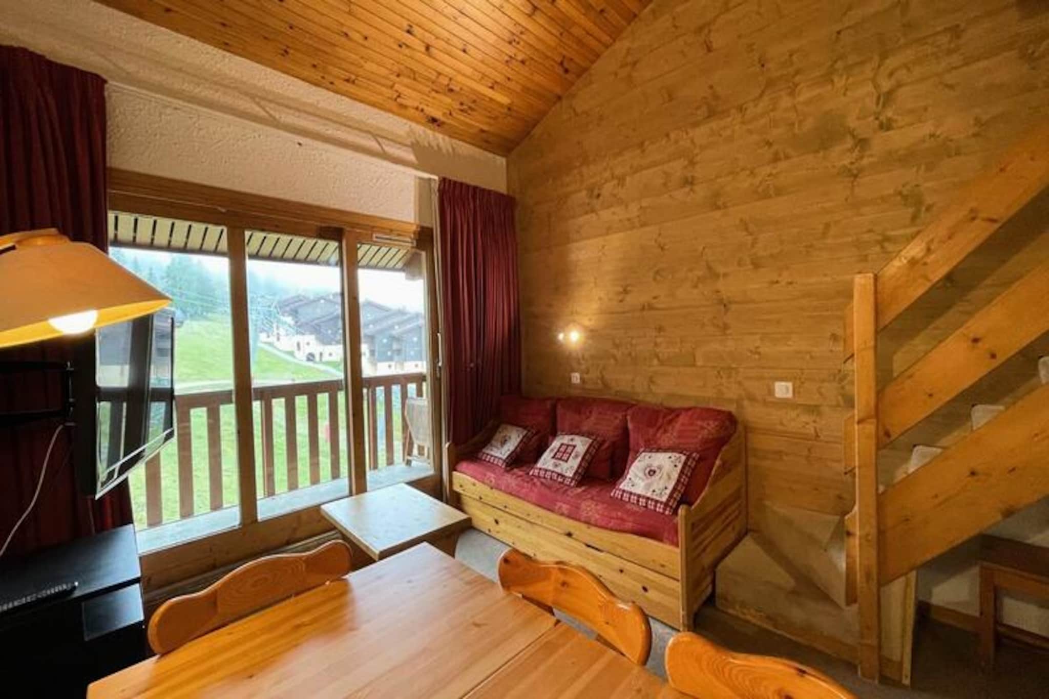 High above the picturesque slopes of Valmorel, this inviting apartment offers a perfect blend of comfort and convenience for your alpine getaway. Located on the 5th floor of the Le Pierrafort residence, it boasts ski-in/ski-out access, ensuring you can step directly onto the snow and start your day of adventure. The south-facing balcony provides stunning views of the slopes, making it an ideal spot to sip your morning coffee or unwind after a day on the pistes. Whether you’re here for winter sports or summer hikes, the breathtaking scenery sets the tone for an unforgettable stay. \n\nInside, the apartment spans 43m² and is thoughtfully designed to accommodate up to six guests. The bright and functional layout includes three separate sleeping areas: a living room with a single sofa bed and trundle bed, a cozy bedroom with two single beds, and a mezzanine featuring two additional single beds. The kitchen is fully equipped with an electric hob, dishwasher, oven, and microwave, making it easy to prepare hearty meals to refuel after your adventures. Additional amenities include a bathroom with a washing machine and a separate toilet, ensuring convenience throughout your stay. Please note that Wi-Fi is not included, and the apartment is non-smoking and pet-free. \n\nThe Le Pierrafort residence is perfectly situated in the Crève Coeur district, just 50 meters from shops and the Télébourg ski lift, and 300 meters from the ESF ski school. Paid parking is available right in front of the residence, making it easy for guests to come and go. The Crève Coeur area is connected to the resort center and the hamlet of Mottet via the Télébourg cable car, offering access to a variety of amenities, including a bakery, mini-market, and sports store. \n\nWhether you’re seeking thrilling ski runs, scenic hiking trails, or simply a cozy retreat in the heart of the French Alps, this apartment provides the perfect base for your Valmorel adventure. With its unbeatable location and charming ambiance, it’s a place where memories are made year-round.