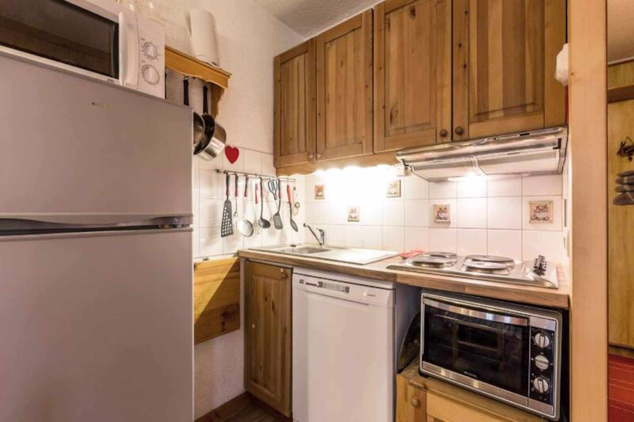 Where the slopes meet serenity, this charming apartment in the Crève Coeur hamlet of Valmorel offers an idyllic alpine retreat for up to four guests. Imagine waking up to the crisp mountain air and stepping onto your southwest-facing terrace, where the views of the snow-covered slopes create a postcard-perfect backdrop for your holiday. Whether you're seeking thrilling ski adventures or peaceful moments surrounded by nature, this cozy accommodation places you right in the heart of it all. The residence is conveniently located just 80 meters from shops and ski lifts, ensuring effortless access to everything you need for a memorable stay. \n\nInside, the apartment is thoughtfully designed for comfort and practicality. The living room features three single beds and a television, creating a welcoming space to unwind after a day on the slopes. A separate bedroom with a double bed provides a tranquil retreat for restful nights. The open-plan kitchen, equipped with a ceramic hob, dishwasher, oven, and microwave, invites you to prepare hearty meals to enjoy with loved ones. Additional amenities include a shower room with a washing machine, a separate toilet, and a ski locker for your convenience. Please note that Wi-Fi is not included, and pets are not allowed, ensuring a peaceful and clean environment for all guests. \n\nThe Crève Coeur hamlet is perfectly situated for exploring Valmorel's charm. Essential shops like a bakery, sports store, and convenience store are just steps away, while the ESF ski school is accessible via the Télèbourg lift, located 350 meters from the residence. Paid parking is available nearby, and car access to the residence makes arrival and departure hassle-free. Whether you're here for winter sports or summer hikes, this apartment offers the perfect base for your alpine adventures. Let the beauty of the French Alps and the welcoming atmosphere of Valmorel create unforgettable memories for your next getaway.