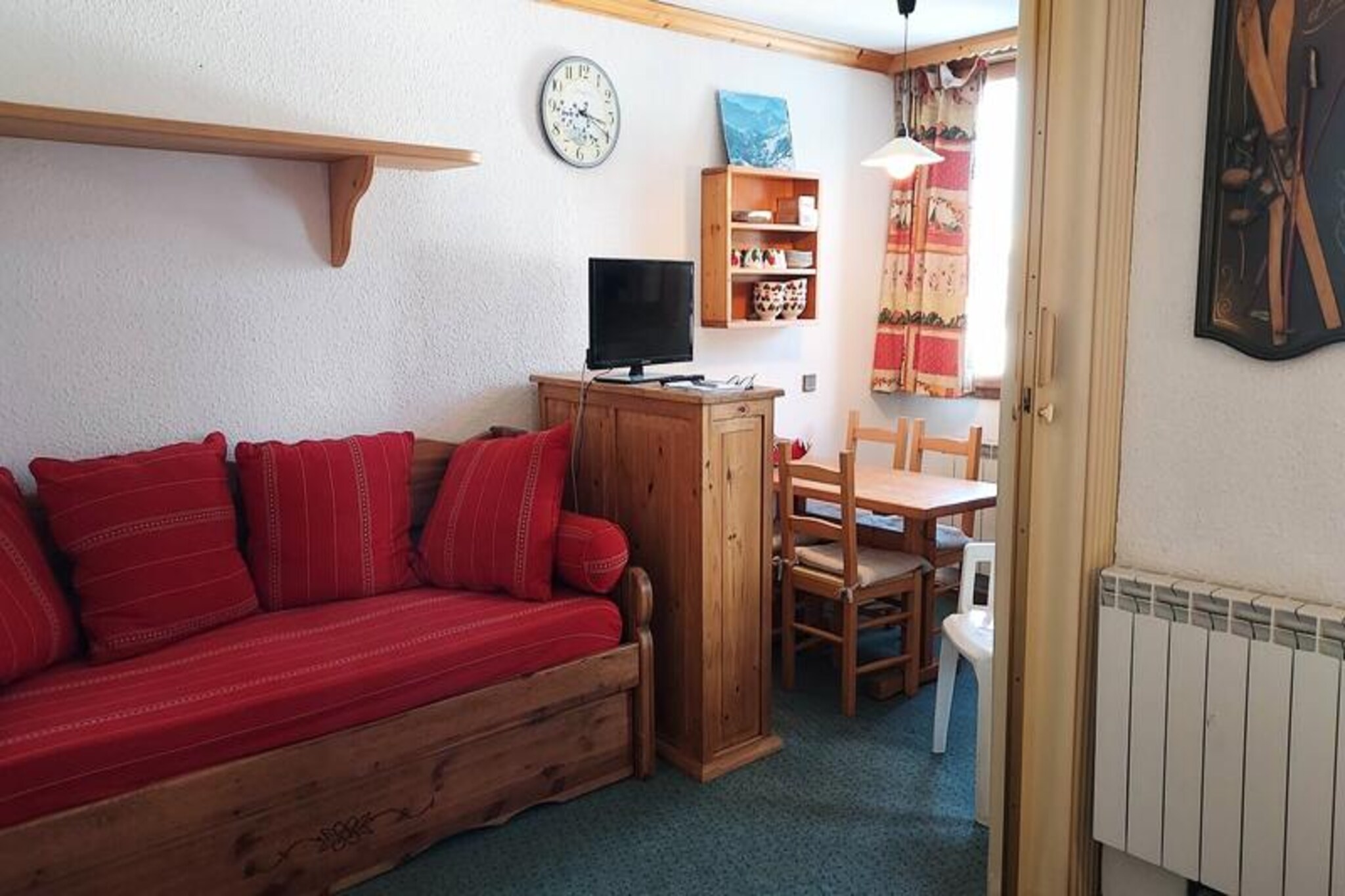 On the edge of Valmorel's enchanting La Forêt district, this cozy studio apartment offers a perfect blend of comfort and convenience for your alpine getaway. Imagine waking up to serene mountain views from your northeast-facing balcony, stepping out to the slopes just 100 meters away, and enjoying effortless access to Le Grand Domaine via the Altispace chairlift. Whether you're here for skiing, hiking, or simply soaking in the tranquil atmosphere, this charming retreat is your gateway to the best of the French Alps. \n\nThe 27 m² apartment is thoughtfully designed to maximize space and functionality. The entrance hall features a fully equipped kitchen with a dishwasher, electric hob, microwave, refrigerator, and even a raclette grill for cozy evenings. The dining area comfortably seats four, while the divisible living room offers flexible sleeping arrangements with a trundle bed and a double bed. A separate bathroom and toilet ensure privacy, and pets are welcome for a small fee. While Wi-Fi is not included, the apartment provides a ski locker for your gear and promises a smoke-free environment for your stay. \n\nLocated in the quiet La Forêt district, the residence \