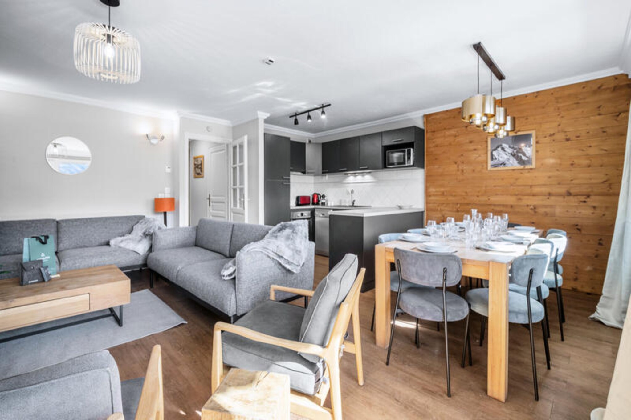 High above the vibrant resort of Val Thorens, this charming chalet-style apartment in the Balcons district offers an unforgettable alpine retreat at an impressive altitude of 2,400 meters. Imagine waking up to breathtaking 180° mountain views from your south-facing balcony, with the crisp mountain air and endless snowy peaks setting the tone for your day. Designed for ski enthusiasts, the residence provides ski-in/ski-out access directly from the garages, ensuring you’re always just moments away from the slopes. \n\nThe spacious ROSAEL4 apartment accommodates up to ten guests, making it ideal for families or groups of friends. The large living room, complete with an open fireplace, creates a cozy gathering space to relax after a day of adventure. The open-plan kitchen and dining area are perfect for shared meals, while five comfortable bedrooms, including an en suite double room, ensure restful nights. Modern amenities such as Wi-Fi and three ski lockers add convenience, while the residence’s wellness area, featuring a swimming pool, sauna, and hammam, invites you to unwind in style.\n\nVal Thorens is a paradise for outdoor lovers, offering world-class skiing and snowboarding in the heart of the Three Valleys, the largest ski area in the world. Beyond the slopes, the resort boasts lively après-ski options, fine dining, and a welcoming alpine atmosphere. In summer, the mountains transform into a haven for hikers and mountain bikers, with trails that showcase the region’s natural beauty.\n\nWhether you’re seeking thrilling winter sports or a serene summer escape, this apartment combines luxury, comfort, and unbeatable access to the best of the French Alps. Make your stay in Val Thorens truly unforgettable with this exceptional alpine retreat.
