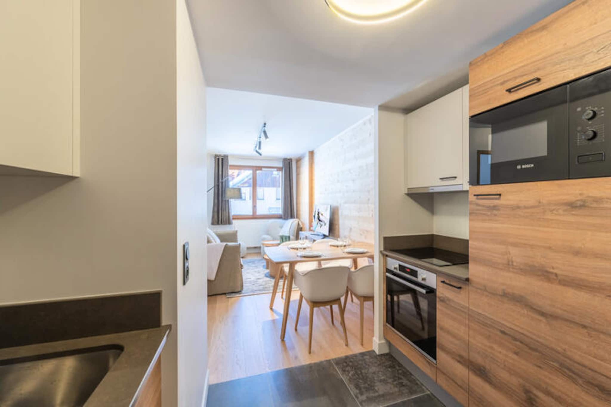 In the charming Vieil Alpe district of Alpe d'Huez, where alpine tradition meets modern comfort, lies the exquisite Fermes de l'Alpe residence. Just 400 meters from the lively resort center, this idyllic retreat offers the perfect blend of convenience and serenity. Imagine waking up to the crisp mountain air and stepping into a world of adventure, with ski slopes and amenities just moments away. The residence, inspired by the rustic beauty of traditional alpine farms, features five elegant chalets that harmoniously blend into the breathtaking surroundings. 
 
 This cozy 41m² apartment is thoughtfully designed to accommodate 2 adults and 2 children, making it an ideal choice for couples or small families. The inviting living room with a comfortable lounge area is perfect for unwinding after a day on the slopes. A dining area and an open-plan equipped kitchen allow for delightful home-cooked meals. The apartment features a serene double bedroom, a sofa bed for additional guests, and a modern bathroom with a shower and toilet. Every detail has been considered to ensure a relaxing and memorable stay, including Wi-Fi, linens, and beds made upon arrival.
 
 Step outside and immerse yourself in the vibrant atmosphere of Alpe d'Huez. From the nearby ski slopes to the bustling resort center, everything you need is within easy reach. Explore the picturesque streets of Vieil Alpe, indulge in local cuisine at charming restaurants, or enjoy après-ski entertainment. In summer, the area transforms into a haven for hiking, cycling, and nature exploration, offering stunning views of the surrounding peaks.
 
 Whether you're seeking thrilling winter sports or a peaceful summer escape, this apartment at Fermes de l'Alpe promises an unforgettable alpine experience. With its prime location, thoughtful amenities, and enchanting ambiance, it’s the perfect base for creating cherished memories in the heart of the French Alps.