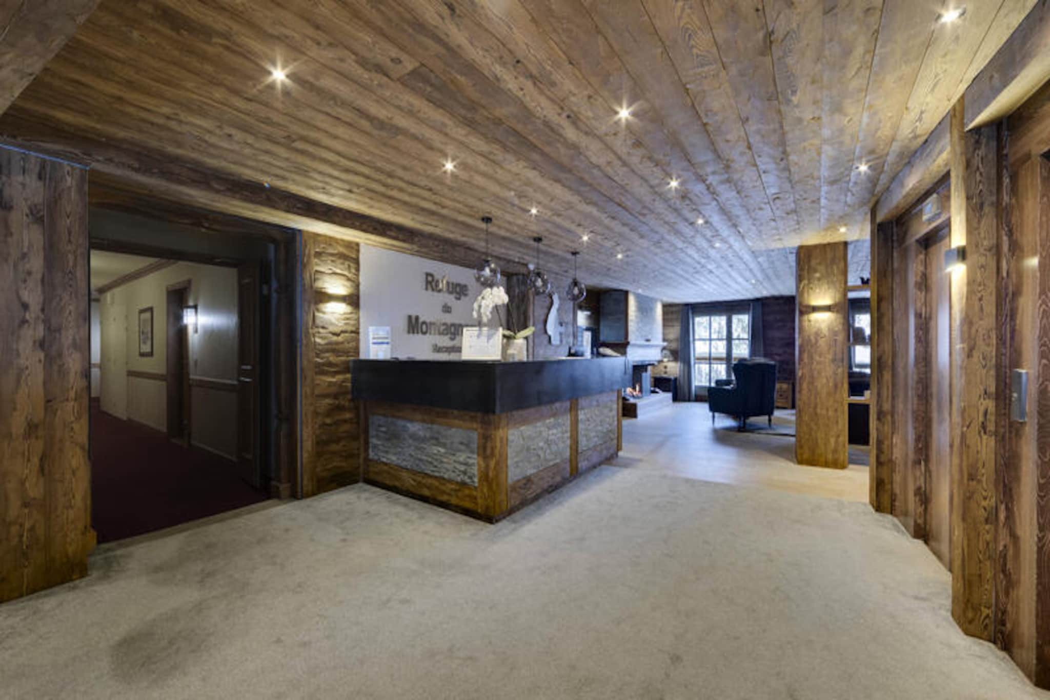 Surrounded by the majestic peaks of the French Alps, the Refuge du Montagnard Residence in Arc 1950 invites you to experience the ultimate alpine getaway. This premium 5-star residence is nestled in a charming pedestrian village, offering direct access to the renowned Paradiski ski area with its 425 km of pristine slopes. Whether you’re seeking thrilling winter adventures or tranquil summer escapes, this destination promises unforgettable moments amidst breathtaking scenery. \n\nThe apartment spans 62m² and is thoughtfully designed to accommodate up to six guests. It features three cozy bedrooms, including a double room with an en-suite bathroom and two twin rooms. The open-plan living area boasts a fully equipped kitchen and dining space, perfect for sharing meals after a day of exploration. Step out onto the terrace to soak in the crisp mountain air and stunning views. Modern amenities such as Wi-Fi, a ski locker, and access to a wellness area with an outdoor pool, jacuzzi, sauna, and steam room ensure a comfortable and rejuvenating stay. \n\nArc 1950 is a haven for outdoor enthusiasts. In winter, enjoy ski-in/ski-out convenience, while summer unveils a paradise of hiking trails, mountain biking routes, and alpine festivals. The village itself offers a variety of shops, restaurants, and après-ski activities, all within walking distance. For those seeking relaxation, the wellness facilities provide the perfect retreat after a day on the slopes or trails. \n\nChoose the Refuge du Montagnard Residence for its blend of luxury, comfort, and unbeatable location. Whether you’re here to carve through powdery slopes or bask in the serenity of alpine landscapes, this residence is your gateway to the wonders of the French Alps.