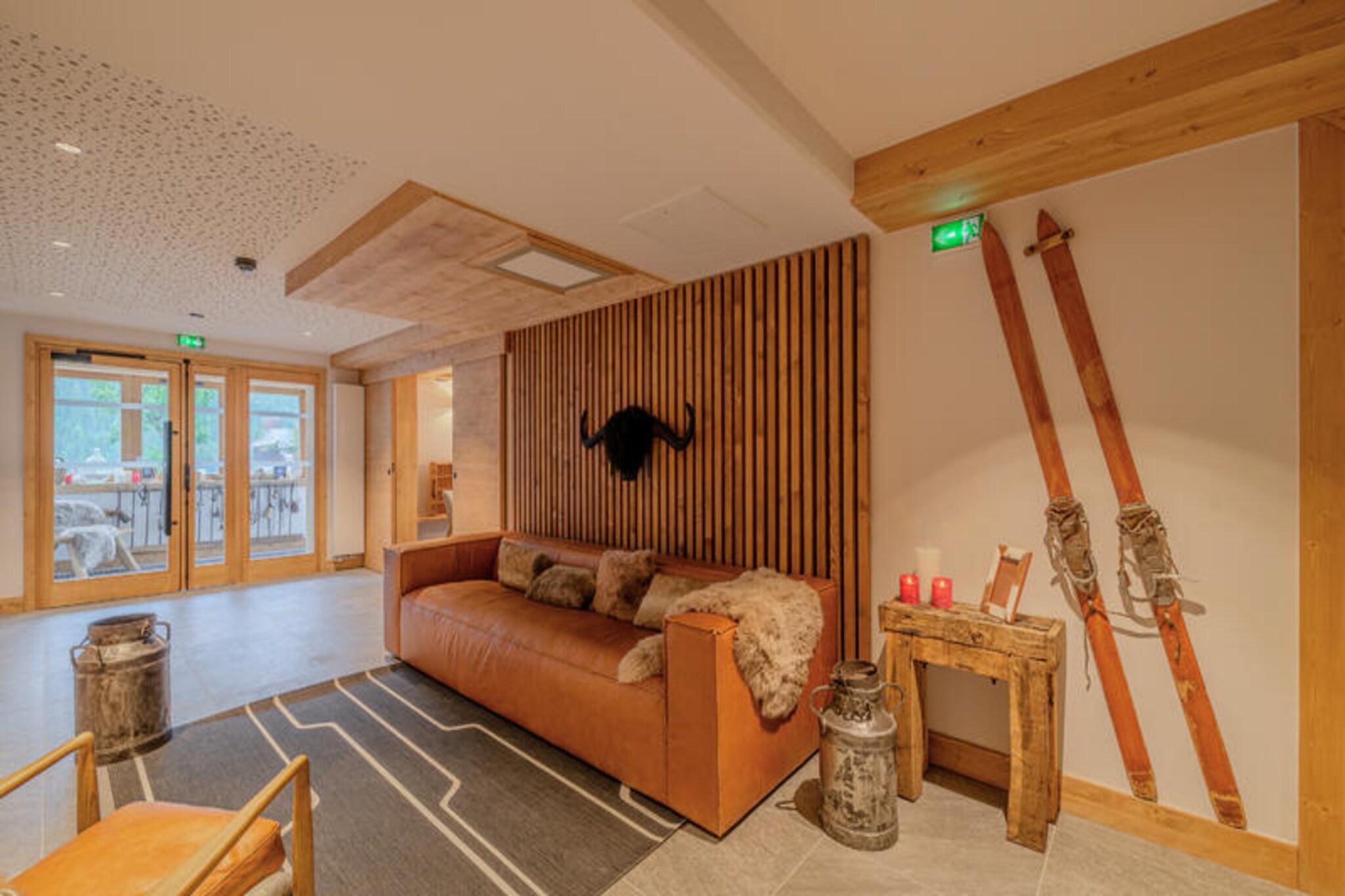 In the heart of the picturesque village of Champagny-en-Vanoise, the Terresens L'Etoile de la Vanoise residence offers a perfect blend of alpine charm and modern comfort. Surrounded by the majestic peaks of the Vanoise National Park, this serene retreat is an ideal destination for those seeking a winter wonderland or a summer escape. Imagine waking up to breathtaking mountain views, stepping onto your private balcony, and breathing in the crisp alpine air as you plan your day of adventure.
The residence features spacious apartments designed with traditional Savoyard architecture, combining warm wood and natural stone for an authentic alpine feel. Each apartment is fully equipped, offering a cozy living room with a double sofa bed, an open-plan kitchen, and comfortable bedrooms. With options ranging from studios to 10-person mountain chalets, there’s a perfect fit for every group, whether you’re traveling with family or friends. Modern amenities such as Wi-Fi, a children’s playroom, and covered parking ensure a hassle-free stay.
Just 250 meters from the ski lifts, you’ll have direct access to the renowned Paradiski area, boasting 425 km of slopes for skiing, snowshoeing, or even dog sledding. In summer, the village transforms into a haven for hikers and nature enthusiasts, with trails leading into the stunning Vanoise National Park. Restaurants, shops, and essential services are all within walking distance, making your stay as convenient as it is memorable.
Whether you’re carving through pristine snow in winter or exploring lush alpine meadows in summer, the Terresens L'Etoile de la Vanoise residence promises an unforgettable mountain getaway. Let the charm of Champagny-en-Vanoise and the comfort of this exceptional residence create memories that will last a lifetime.
