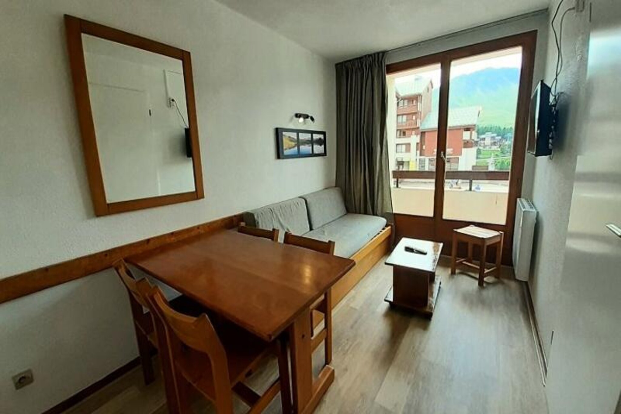 Bask in the golden glow of Plagne Soleil, where this charming one-bedroom apartment offers a cozy retreat amidst the breathtaking French Alps. Perfectly situated in the heart of the resort, this residence provides direct access to the slopes, ensuring that your alpine adventures begin just steps from your door. With its southwest-facing balcony, you can soak up the sun and revel in panoramic mountain views, making every moment here unforgettable. Whether you're a skier seeking thrilling descents or a walker eager to explore serene pedestrian paths, Plagne Soleil promises something special for everyone.
This thoughtfully designed 26m² apartment comfortably accommodates up to five guests. The living room features a sofa bed and a television, creating a welcoming space to unwind after a day on the slopes. The open-plan kitchen is fully equipped with modern appliances, including an oven, microwave, ceramic hob, refrigerator, and dishwasher, making it easy to prepare hearty meals. The bedroom offers a cozy double bed, while a separate sleeping area with a bunk bed ensures comfort for families or groups. A bathroom with a bathtub and a separate toilet add convenience to your stay. Additional amenities such as a ski locker and elevator access enhance your experience.
Plagne Soleil lives up to its name with its sunny disposition and central location within the ski area. A free shuttle connects you to neighboring Plagne Village, expanding your options for dining, shopping, and exploring. Families will appreciate the proximity to the kindergarten, while all guests can enjoy the vibrant atmosphere of the resort. Whether you're here for winter sports or summer hikes, this apartment is your gateway to the beauty and excitement of the Alps.
Choose this delightful retreat for your next mountain escape and create memories that will last a lifetime.