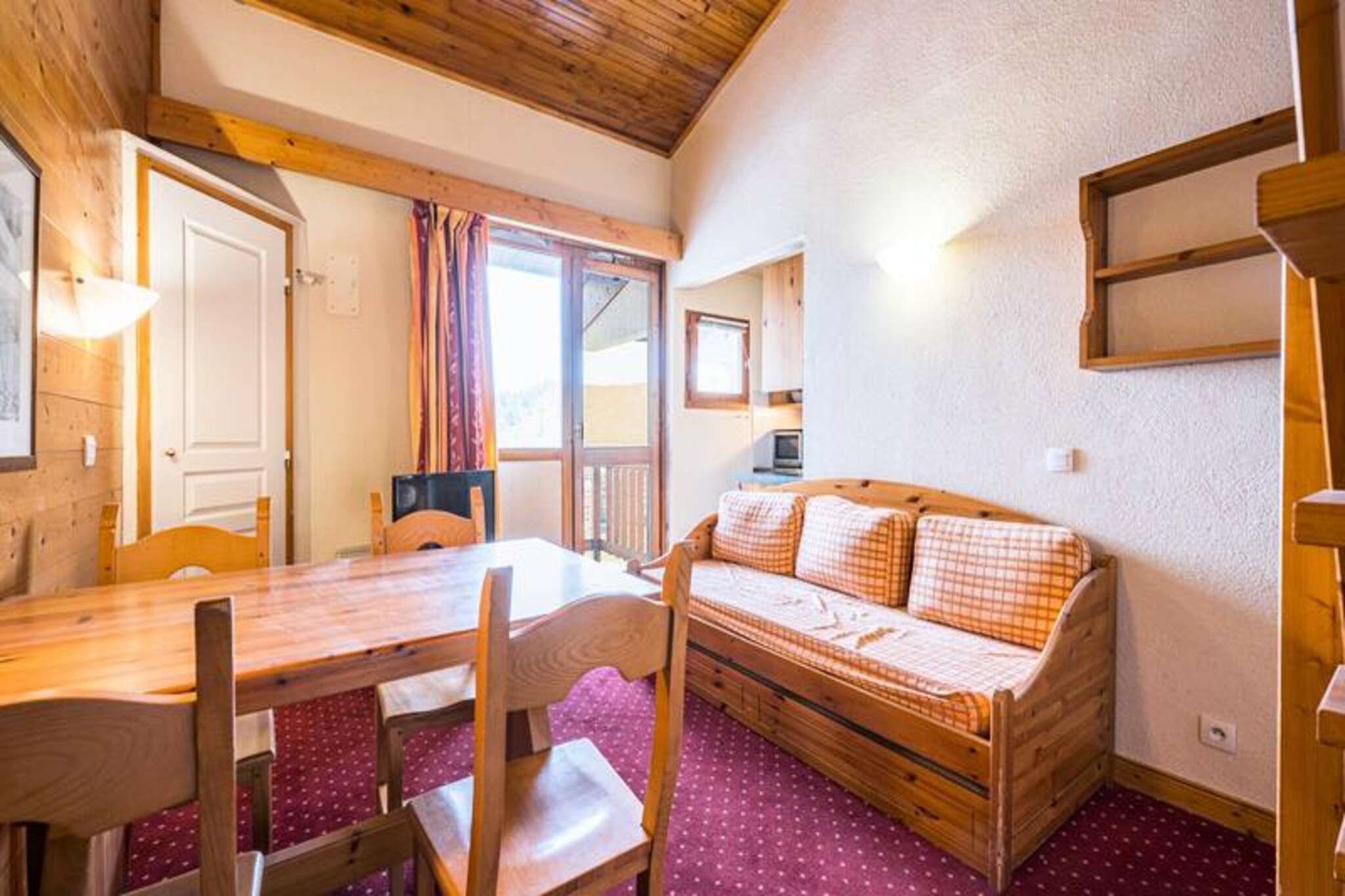 High above the Tarentaise Valley, at an altitude of 2,050 meters, this charming one-bedroom apartment in the Les Hameaux 1 Residence offers a perfect alpine retreat in Plagne Villages. With its cozy mezzanine layout and a north-facing balcony, this top-floor apartment invites you to soak in the serene mountain atmosphere while being just steps away from the slopes and the vibrant resort center. Whether you're here for winter sports or summer hikes, this location promises an unforgettable stay in the heart of the French Alps. 
 
 The apartment, designed for up to four guests, features a warm and functional layout. The living room includes a pull-out sofa bed for two, a flat-screen television, and an open-plan kitchen equipped with modern appliances such as a microwave, ceramic hob, refrigerator, dishwasher, and coffee maker. The mezzanine bedroom, accessible via a staircase, offers two single beds and ample storage space, creating a cozy and private sleeping area. A bathroom with a bathtub and a separate toilet ensure convenience, while additional amenities like a ski locker make this property ideal for ski enthusiasts.
 
 Plagne Villages is a family-friendly resort directly connected to the expansive La Plagne ski area. The ESF ski school, cable car, and local shops are all within easy reach, while a free shuttle service links Plagne Villages to nearby Plagne Soleil. In summer, the area transforms into a haven for hikers and nature lovers, with breathtaking trails and panoramic views of the surrounding peaks. The residence’s proximity to the slopes makes it a dream destination for skiers, while its tranquil setting ensures a relaxing escape year-round.
 
 Whether you're carving through fresh powder in winter or exploring alpine meadows in summer, this apartment offers the perfect base for your mountain adventures. Create lasting memories in this idyllic retreat, where the beauty of the Alps is always at your doorstep.
