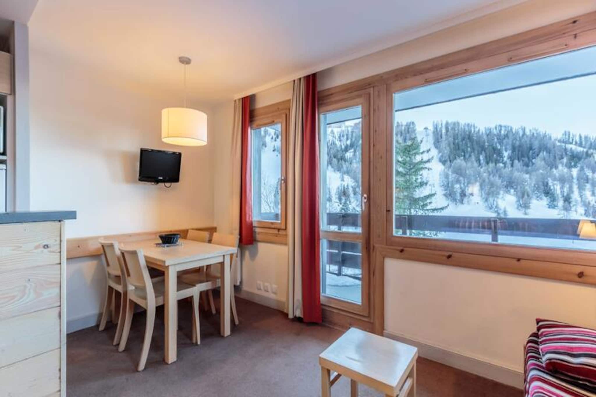Bask in the golden glow of the French Alps from this charming 30m² apartment, perfectly situated on the first floor of a cozy residence in the heart of the forest. With a west-facing balcony, you’ll be treated to uninterrupted mountain views and abundant sunshine, creating the perfect backdrop for your alpine escape. Whether you're seeking adventure or tranquility, this property offers a warm and inviting retreat for couples or small families. 
 
 Inside, the apartment is thoughtfully designed to maximize comfort and functionality. The bright living room features a seating area with two trundle beds and a sofa bed, ideal for relaxing after a day on the slopes. A fully equipped open kitchen invites you to prepare delicious meals with ease, complete with a microwave, ceramic hob, coffee maker, and more. The separate bedroom boasts a cozy double bed, while the bathroom includes a bathtub for a soothing soak. A separate toilet adds convenience. Additional amenities include a ski locker and a covered winter parking space, ensuring a hassle-free stay.
 
 The surrounding resort is a haven for families, offering a serene atmosphere nestled amidst lush forests. Shops are conveniently located nearby, and a shuttle service connects you to Plagne Centre until late at night, making it easy to explore the area. In winter, enjoy the thrill of skiing with easy access to the slopes, while summer brings opportunities for hiking and immersing yourself in nature. 
 
 Whether you’re here to carve through fresh powder or unwind under the alpine sun, this apartment provides the perfect base for unforgettable memories in the French Alps. Don’t miss the chance to experience the charm and beauty of this idyllic mountain retreat.