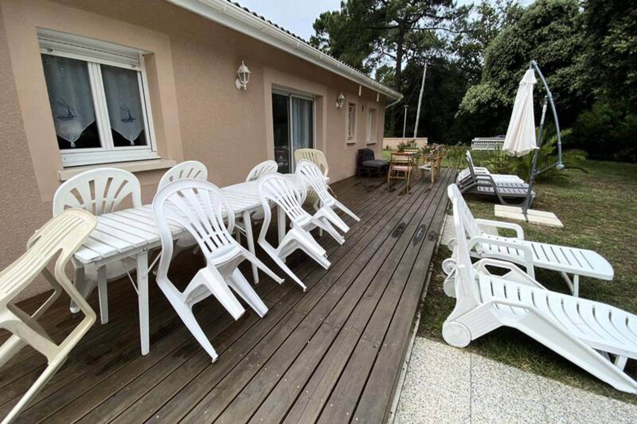A charming villa awaits you in the heart of the French countryside, surrounded by lush greenery and tranquility. This inviting property is perfect for families or groups seeking a peaceful retreat with all the comforts of home. Imagine waking up to the sound of birdsong and enjoying your morning coffee in the spacious garden, where the sun filters through the trees and creates a serene atmosphere for relaxation and outdoor activities. Whether you're planning a summer getaway or a cozy winter escape, this villa offers an idyllic setting for unforgettable memories. \n\nInside, the villa boasts a bright and airy living space with a comfortable living room and dining area, ideal for gathering together after a day of exploration. The open and fully equipped kitchen makes meal preparation a breeze, while the three bedrooms cater to a variety of needs. Two bedrooms feature double beds (160cm and 140cm), and the third is perfect for children with four single bunk beds and its own shower room and WC. A separate bathroom and WC add convenience, and the house is thoughtfully equipped to accommodate young children. \n\nStep outside to discover the expansive 1092 m² fenced and wooded grounds, where you can unwind on deckchairs, enjoy meals al fresco with the barbecue, or simply soak up the natural beauty of the surroundings. The property also offers private parking, ensuring ease and security during your stay. \n\nLocated within easy reach of local attractions and facilities, this villa is the ideal base for exploring the region's charm. Whether you're visiting nearby beaches, picturesque villages, or enjoying outdoor adventures, you'll find everything you need for a perfect holiday. Let this delightful villa be your home away from home, where relaxation and discovery go hand in hand.