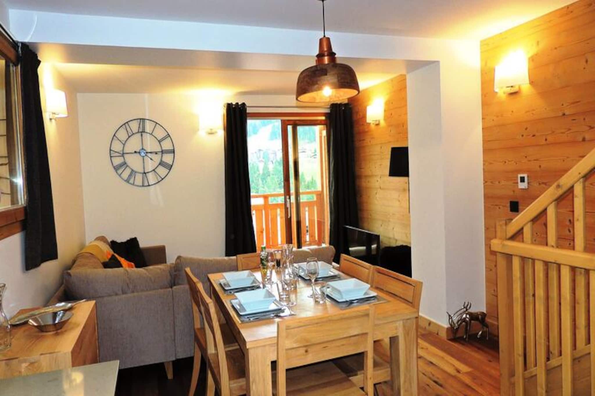 High above the charming village, this exquisite triplex apartment offers a luxurious alpine retreat with breathtaking views of the entire ski area. Bathed in natural light and designed with a harmonious blend of modern comfort and traditional wood-clad charm, this property is a haven for ski enthusiasts and mountain lovers alike. Its southeast-facing orientation ensures you wake up to the golden hues of sunrise over the slopes, setting the perfect tone for your day.
Spanning 63.60 m², this 3-star apartment comfortably accommodates up to six guests. The ground floor features a welcoming entrance hall and a master bedroom with a plush double bed that can be converted into two singles, complete with an en-suite shower room and modern amenities like a TV and washer-dryer. The first floor boasts a fully equipped kitchen that opens into a cozy living and dining area, leading to a semi-sheltered balcony with panoramic views. The attic offers a sleeping alcove with bunk beds, an additional double bedroom with balcony access, and a stylish shower room. Modern conveniences such as electric underfloor heating, Wi-Fi, Apple TV, and Bose speakers ensure a comfortable and connected stay.
Located just 400 meters from the village center and shops, and 650 meters from the nearest ski slopes, this apartment is perfectly positioned for both convenience and adventure. The French Ski School is a short 850-meter stroll, and a shuttle stop is just 230 meters away, making it easy to explore the area. After a day on the slopes, unwind in the comfort of your private ski locker, or enjoy a warm drink on the balcony as you take in the stunning alpine vistas.
With its combination of prime location, exceptional amenities, and cozy ambiance, this triplex apartment is the ideal choice for families or groups seeking an unforgettable mountain getaway. Let Kilimandjaro be your gateway to the ultimate alpine experience.