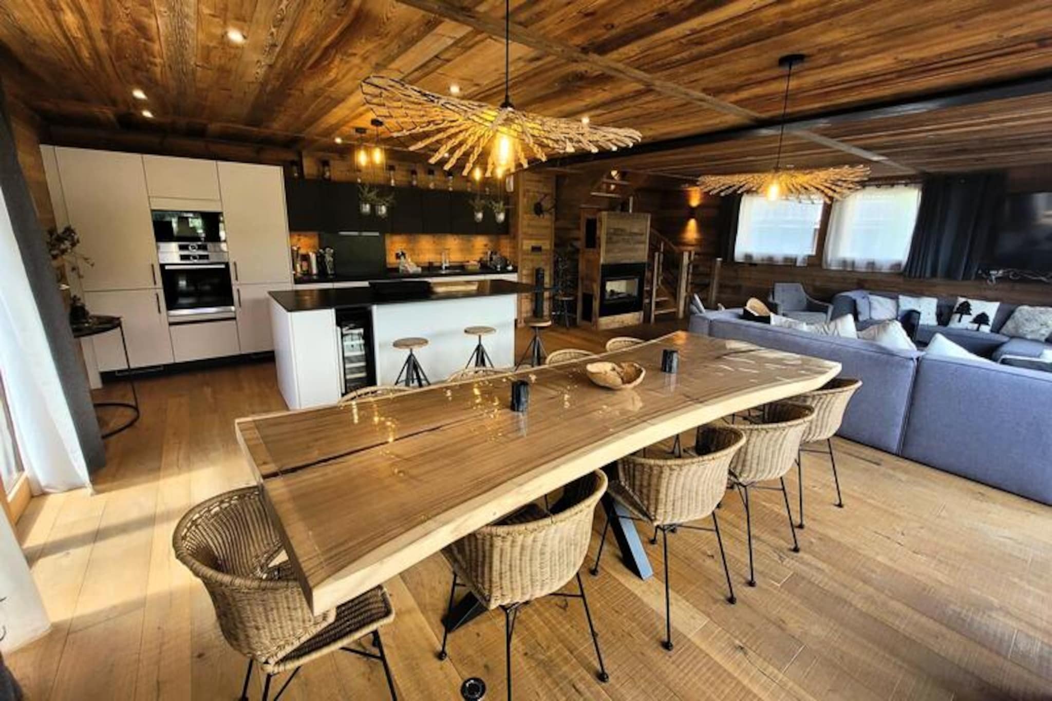 Perched on the serene hills of Les Gets, this luxurious 5-star chalet offers an unparalleled alpine retreat. With breathtaking panoramic views of the surrounding slopes and the charming village below, this property combines the best of traditional Savoyard architecture and contemporary elegance. Bathed in natural light, every corner of this chalet exudes sophistication and warmth, making it the perfect haven for families or groups of friends seeking a memorable mountain escape. The peaceful setting ensures tranquility, while the proximity to the village center and ski slopes keeps you connected to all the action.
Spanning four levels, the chalet accommodates 12 to 14 guests in utmost comfort. The first level features three beautifully designed bedrooms, including a bunk room perfect for children, all with en-suite facilities and access to a sun-drenched terrace. The second level boasts a grand living area with a fully equipped kitchen, opening onto two south-facing terraces. Here, you’ll find an outdoor dining space and a private jacuzzi to unwind after a day on the slopes. The top floor houses a stunning master suite with cathedral windows offering sweeping views, while the lower level includes a cozy cabin bedroom, a sauna with a shower, and a laundry area.
Equipped with high-end amenities such as a gas fireplace, underfloor heating, smart TVs, and a wine cellar, this chalet ensures a seamless blend of luxury and practicality. Guests can also enjoy the convenience of two indoor garages, a ski room, and an elevator. Additional services like end-of-stay cleaning, linens, and bathrobes are included, making your stay effortless and indulgent.
Located just 450 meters from the village center and 650 meters from the ski slopes, this chalet offers the perfect balance of seclusion and accessibility. Whether you’re skiing in winter, hiking in summer, or simply soaking in the jacuzzi with a view, this property promises an unforgettable alpine experience.