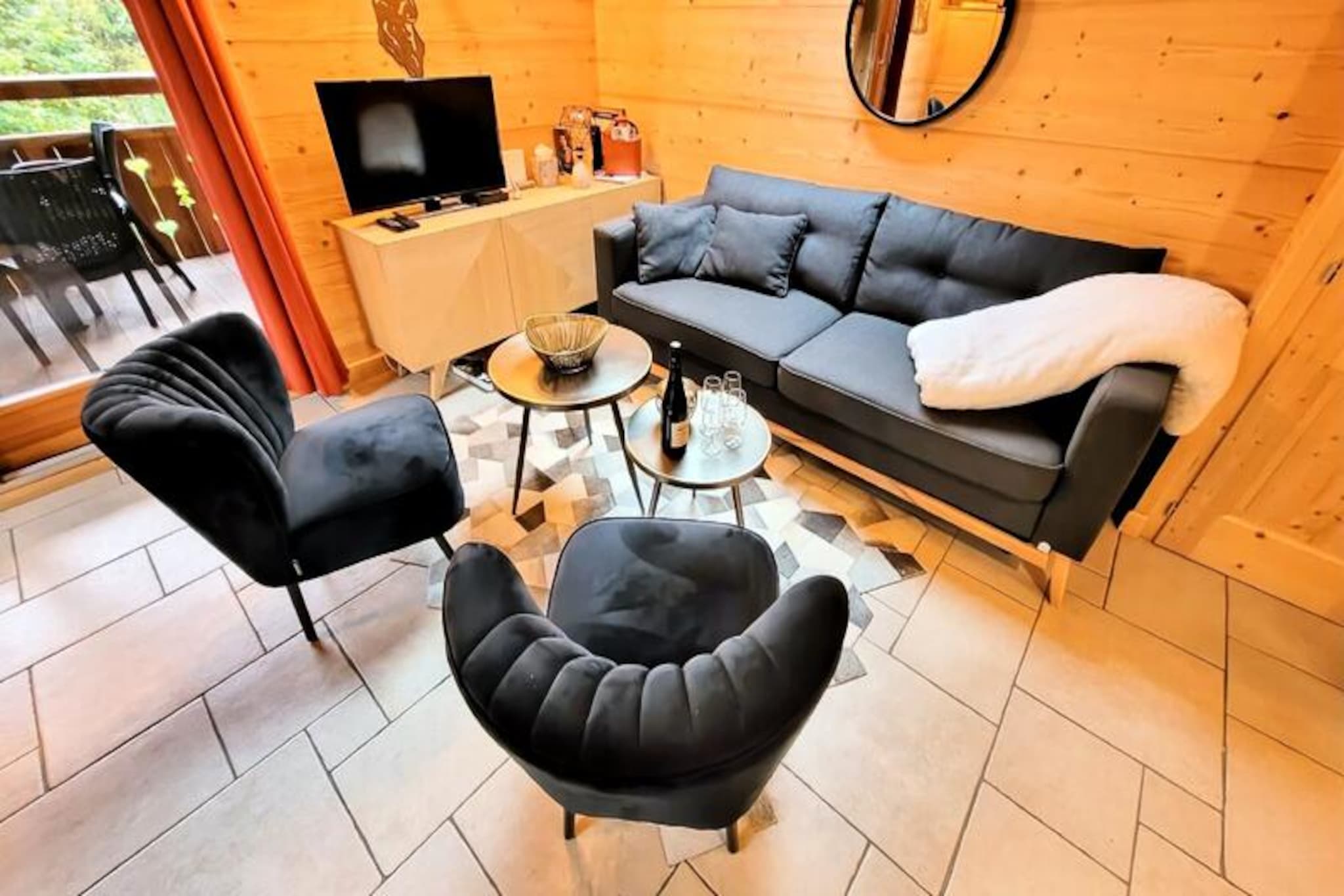 In the heart of the French Alps, where the charm of Les Gets village meets serene mountain landscapes, this delightful attic apartment offers an unforgettable retreat. Perfect for couples or small families, it combines a peaceful setting with convenient proximity to the resort center, just a short walk away. Imagine starting your mornings on the east-facing covered terrace, sipping coffee as the first rays of sunlight illuminate the surrounding peaks. Whether you're here for a snowy winter escape or a summer adventure, this cozy haven invites you to relax and immerse yourself in alpine beauty.
Thoughtfully designed to accommodate up to four guests, the apartment features a warm and inviting living space with a sitting area and a fully equipped kitchen. The double bedroom offers a restful retreat with ample storage, while the sleeping alcove with a bunk bed is perfect for children or additional guests. The bathroom, complete with a bathtub and towel dryer, ensures comfort after a day of exploring. Modern amenities such as Wi-Fi, a flat-screen TV, and a washer-dryer add convenience, while the provided raclette and fondue sets invite you to savor local culinary traditions.
Located just 600 meters from the village center and 700 meters from the Mt Chéry ski slopes, the apartment is ideally situated for both skiing enthusiasts and those looking to explore Les Gets' vibrant shops, restaurants, and cultural offerings. In summer, the region transforms into a paradise for hikers and cyclists, with trails weaving through lush meadows and forests. A garage space for bikes or ski equipment and a shared outdoor parking spot add practicality to your stay.
Whether you're drawn by the allure of pristine slopes, the charm of alpine villages, or the promise of tranquil mornings on the terrace, this apartment offers the perfect base for your Les Gets adventure. Let the magic of the mountains inspire your next getaway.
