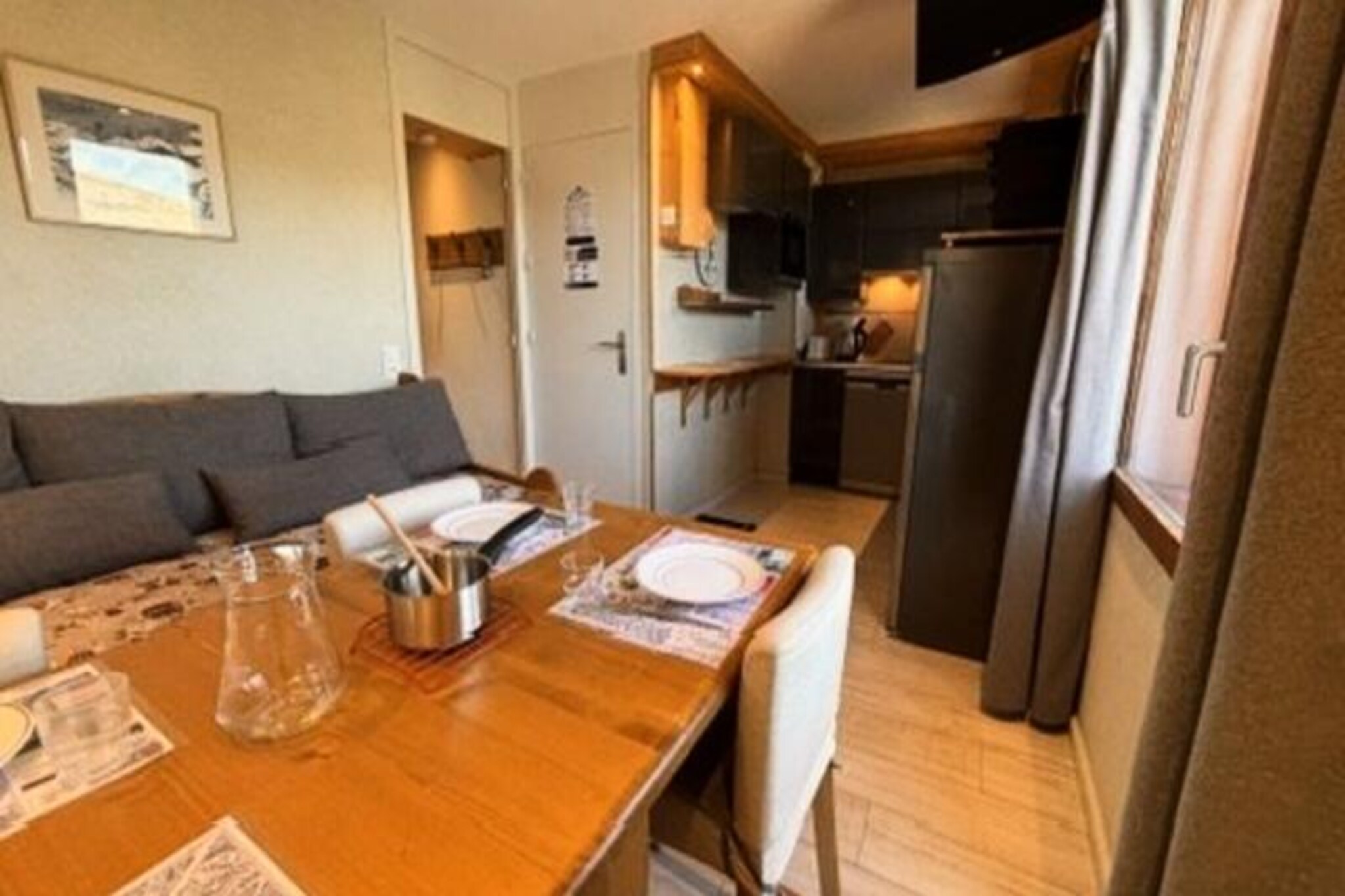 With breathtaking views of Mont Blanc and a prime location in the heart of Les Coches, this charming 22 m² apartment offers an intimate alpine retreat for up to four guests. Situated on the 4th floor of a centrally located residence (accessible via the 1st floor from the secondary entrance), this cozy space is perfect for couples or small families seeking a comfortable and convenient mountain escape. The apartment’s northwest-facing orientation ensures stunning sunsets over the peaks, creating a magical ambiance after a day on the slopes. \n\nInside, the apartment features a thoughtfully designed layout with a bedroom furnished with a double bed, and a living room equipped with a single bed and trundle bed, making it ideal for flexible sleeping arrangements. The kitchenette, integrated into the living area, is fully equipped with modern appliances, including an oven, dishwasher, microwave, induction hobs, and even a raclette and fondue set for a true taste of the Alps. A television and cozy furnishings complete the inviting atmosphere, while the shower room with a toilet ensures all essentials are met. \n\nThe residence itself is perfectly positioned at the foot of the slopes, with direct access to the vibrant Place des Commerces. Here, you’ll find a variety of shops, restaurants, and amenities, as well as the ESF ski school and daycare, making it an excellent choice for families. The Carreau neighborhood is known for its lively atmosphere, hosting numerous activities and events throughout the season. For added convenience, a ski locker is available, and underground parking can be reserved in advance. \n\nWhether you’re here to carve through the Paradiski slopes, explore the charming village, or simply relax and soak in the alpine beauty, this apartment offers the perfect base for an unforgettable mountain getaway. Non-smoking and pet-free, it ensures a clean and tranquil environment for all guests.