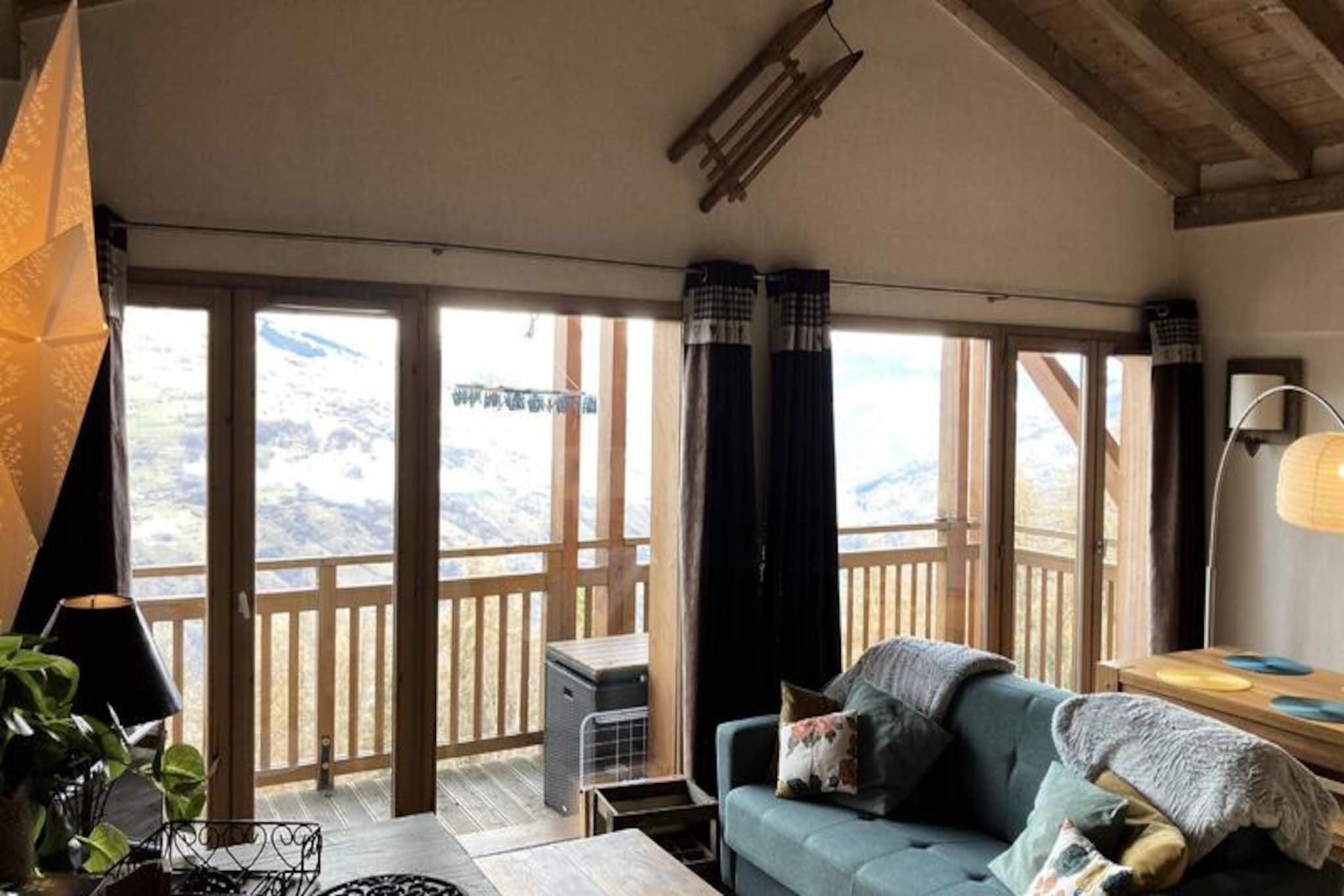 On the edge of the picturesque Mont Blanc valley, this charming 56 m² apartment offers a cozy retreat for up to six guests. Located on the first floor of a small chalet, it combines alpine charm with modern amenities, making it an ideal choice for families or groups seeking an unforgettable mountain getaway. Imagine waking up to breathtaking views of Mont Blanc from your north-facing balcony, breathing in the crisp mountain air, and stepping into a day filled with adventure in the heart of Les Coches. \n\nThe apartment features a thoughtful layout, including a master bedroom with a 160 cm double bed and en-suite shower, an attic bedroom with two single beds, and a living room equipped with a 140 cm sofa bed and TV. The kitchen is fully equipped with a dishwasher, combination oven, induction hobs, refrigerator, and even a raclette set for a true taste of the Alps. Additional conveniences include a bathroom, separate toilet, and private covered parking. Guests also have access to a ski locker in the main residence. \n\nThe luxury residence itself is a gem, blending slate, stone, and wood for a warm and inviting atmosphere. Relax in the heated indoor pool, enjoy a game of billiards in the reception lounge, or take advantage of the laundry facilities. Located just steps from the resort center, you'll find shops, restaurants, and the ESF ski school nearby. The first chairlift to the La Plagne ski area is only 150 meters away, while the Vanoise Express cable car offers seamless access to Les Arcs. \n\nWhether you're here for thrilling ski adventures or summer hikes, this apartment provides the perfect base for exploring the stunning French Alps. With its blend of comfort, convenience, and breathtaking views, it promises a memorable stay for all seasons.