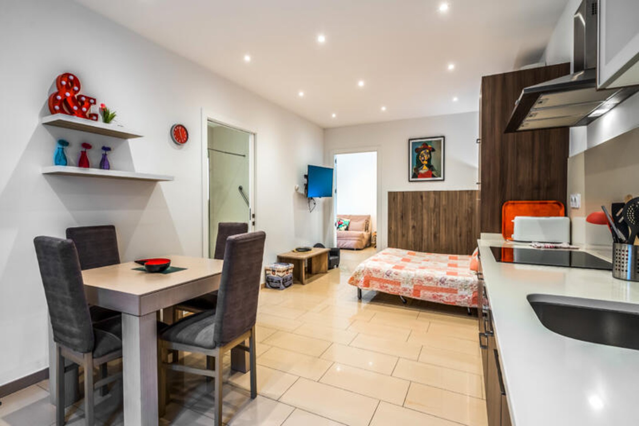 Imagine waking up to the gentle sound of waves and stepping out onto your private terrace to enjoy a coffee with breathtaking views of the Costa Brava. Located in the heart of Empuriabrava, just steps from the golden sands of the beach, this high-quality apartment offers the perfect blend of comfort, accessibility, and seaside charm. Whether you’re seeking a relaxing retreat or an active holiday, this property caters to all your needs.
Designed to accommodate up to four guests, with the option for a fifth, the apartment features a master bedroom with a luxurious orthopedic mattress and a cozy sofa bed in the living room. The open-plan kitchen is fully equipped with modern appliances, making it easy to prepare meals to enjoy on the terrace overlooking the beach. The spacious, adapted bathroom and accessible layout ensure a comfortable stay for guests with reduced mobility. A Smart TV with multilingual channels and free WiFi add to the convenience, making it ideal for longer stays.
The La Vida Sin Límites complex enhances your holiday experience with exceptional shared amenities, including a solarium, outdoor barbecue area, ping-pong table, children’s playground, and a relaxation zone. Guests can also enjoy free parking and complimentary bicycles to explore the picturesque streets of Empuriabrava, the scenic Aiguamolls National Park, and nearby nature reserves. Private parking is available for an additional fee during high season.
Empuriabrava’s vibrant atmosphere, with its array of restaurants, shops, and activities, ensures there’s something for everyone. Whether you’re strolling along the promenade, discovering hidden trails, or simply soaking up the Mediterranean sun, this apartment is your gateway to an unforgettable Costa Brava escape.