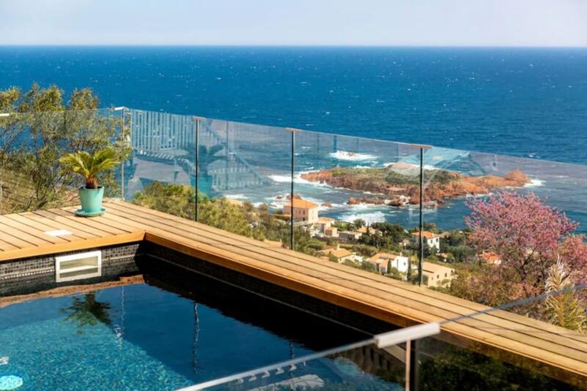 Imagine waking up to the shimmering blue of the Mediterranean, with the scent of pine trees and the iconic red rocks of the Estérel massif surrounding you. This contemporary villa on the French Riviera offers a serene retreat for up to 8 guests, blending modern luxury with the timeless charm of the Côte d'Azur. Whether you're here to relax by the pool or explore the vibrant region, this villa is your gateway to an unforgettable escape. 

Spread across four levels, the villa boasts 1,000 m² of outdoor space and breathtaking sea views from every corner. The ground floor features a bright living and dining area with direct access to a terrace, a fully equipped kitchen, and multiple outdoor spaces perfect for al fresco dining. Upstairs, three sea-view bedrooms, including two with queen-size beds, provide a restful haven, while the private heated pool and sun-drenched terraces invite you to unwind in style. Modern amenities, such as a JBL speaker and BBQ facilities, ensure your stay is as comfortable as it is memorable. 

Located in the heart of the Estérel massif, the villa is a paradise for nature lovers and adventurers. Explore hiking and mountain biking trails, or take a short drive to the nearby beaches to enjoy crystal-clear waters and water sports. The glamour of Cannes is just 25 minutes away, while Nice Airport and Saint-Tropez are within easy reach, making this the perfect base for discovering the treasures of the French Riviera. 

Whether you're seeking tranquility, adventure, or a mix of both, this villa offers the perfect setting for creating cherished memories. Let the beauty of the Mediterranean inspire your next getaway.