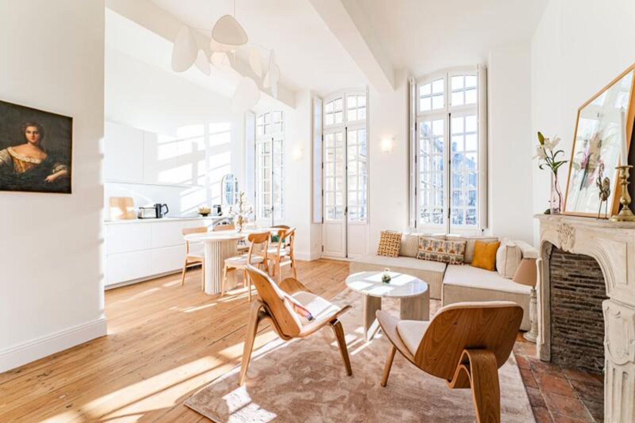 In the heart of Bordeaux's historic charm, this elegant apartment on Place du Parlement offers an unmatched setting for your stay. Surrounded by the cobbled streets and iconic architecture of this UNESCO World Heritage Site, it invites you to immerse yourself in the city's vibrant culture. The lively terraces, quaint cafés, and boutique shops just steps away create an atmosphere brimming with life and authenticity, perfect for travelers seeking both relaxation and exploration.
Inside, the apartment blends modern comfort with timeless elegance. The bright living room, featuring a period stone fireplace and a view of the picturesque square, is a welcoming space to unwind. A comfortable sofa bed and tasteful decor add to its charm. The open-plan kitchen is fully equipped, making it easy to prepare meals to enjoy at the cozy dining table. The serene bedroom promises restful nights, while the modern bathroom, complete with a spacious shower, ensures a refreshing start to your day.
Step outside and find yourself within walking distance of Bordeaux's most celebrated landmarks, including the stunning Place de la Bourse and the historic Grosse Cloche. The nearby quays invite leisurely strolls along the Garonne River, while the surrounding streets are filled with culinary delights and wine bars showcasing the region's finest vintages.
Whether you're here to explore Bordeaux's rich history, indulge in its world-famous gastronomy, or simply soak in the city's unique ambiance, this apartment is your perfect pied-à-terre. Let the charm of Bordeaux captivate you from this exceptional location.