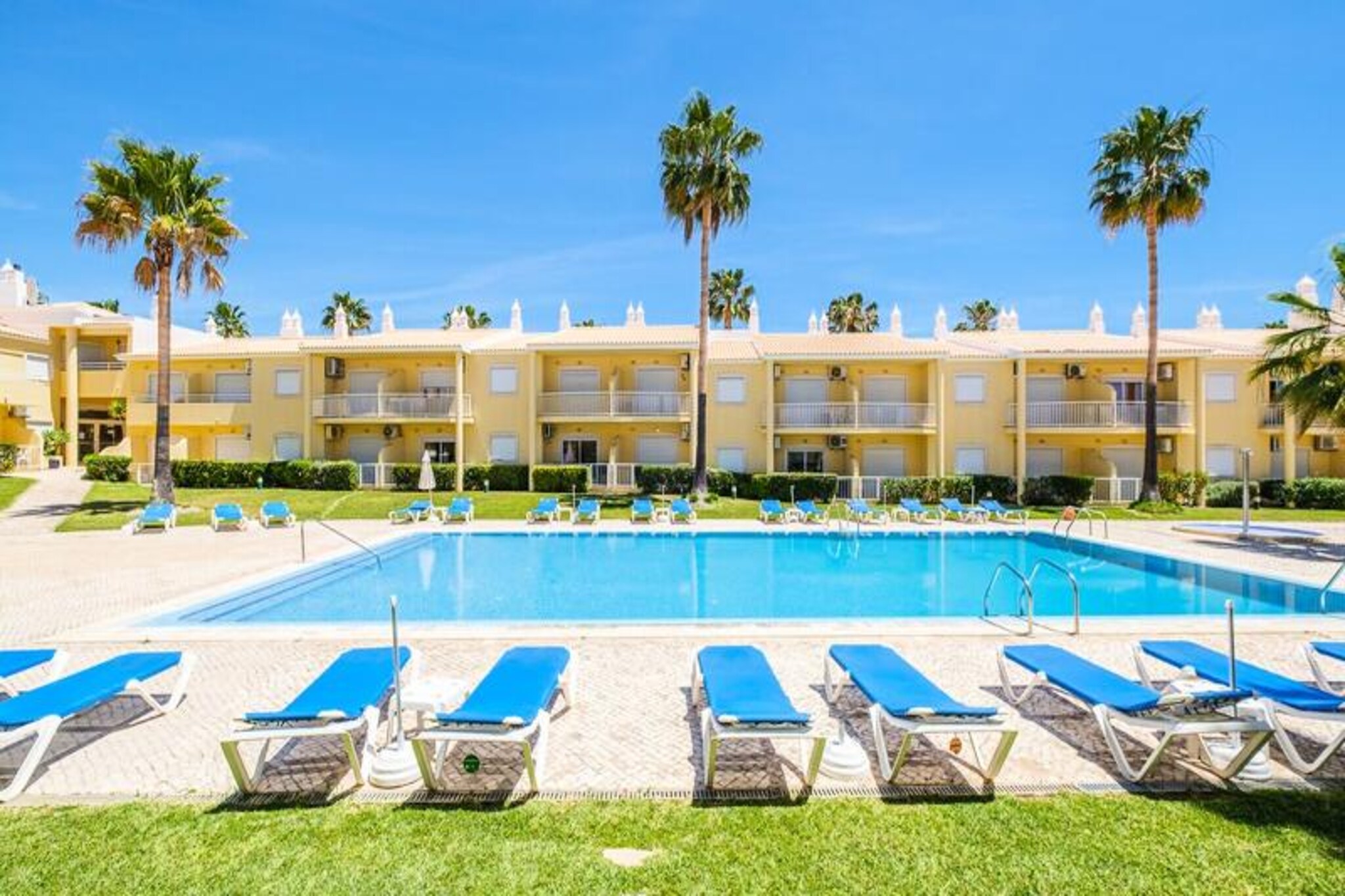 In the heart of the Algarve, where golden beaches meet the azure Atlantic, this beautifully renovated two-bedroom apartment is your gateway to a serene coastal escape. With its modern design and meticulous attention to detail, the Benjamin apartment offers a warm and inviting atmosphere, perfect for families or groups of up to four seeking a relaxing getaway. Just a short drive from the stunning beaches of Galé, Salgados, and Manuel Lourenço, this property combines convenience with the charm of Portugal’s sun-soaked coastline.
Step inside and discover a space thoughtfully designed for comfort and ease. The apartment is fully equipped with everything you need for a hassle-free holiday, from a modern kitchen stocked with all essential utensils to a cozy living area featuring a smart TV with over 100 channels and reliable Wi-Fi. Each room has been carefully decorated to create a welcoming ambiance, while the provided linens and towels ensure a seamless stay. The condo also boasts a large shared swimming pool for adults and children, as well as a bar, making it an ideal spot to unwind after a day of exploring.
Beyond the apartment, you’ll find yourself surrounded by a variety of attractions. Aldi stores and excellent local restaurants are just minutes away, offering a taste of the region’s rich culinary heritage. Whether you’re lounging by the pool, strolling along the nearby beaches, or enjoying a meal at a seaside café, this location places you at the heart of the Algarve’s best offerings.
Choose the Benjamin apartment for your next holiday and experience the perfect blend of relaxation, convenience, and the unparalleled beauty of Portugal’s southern coast.