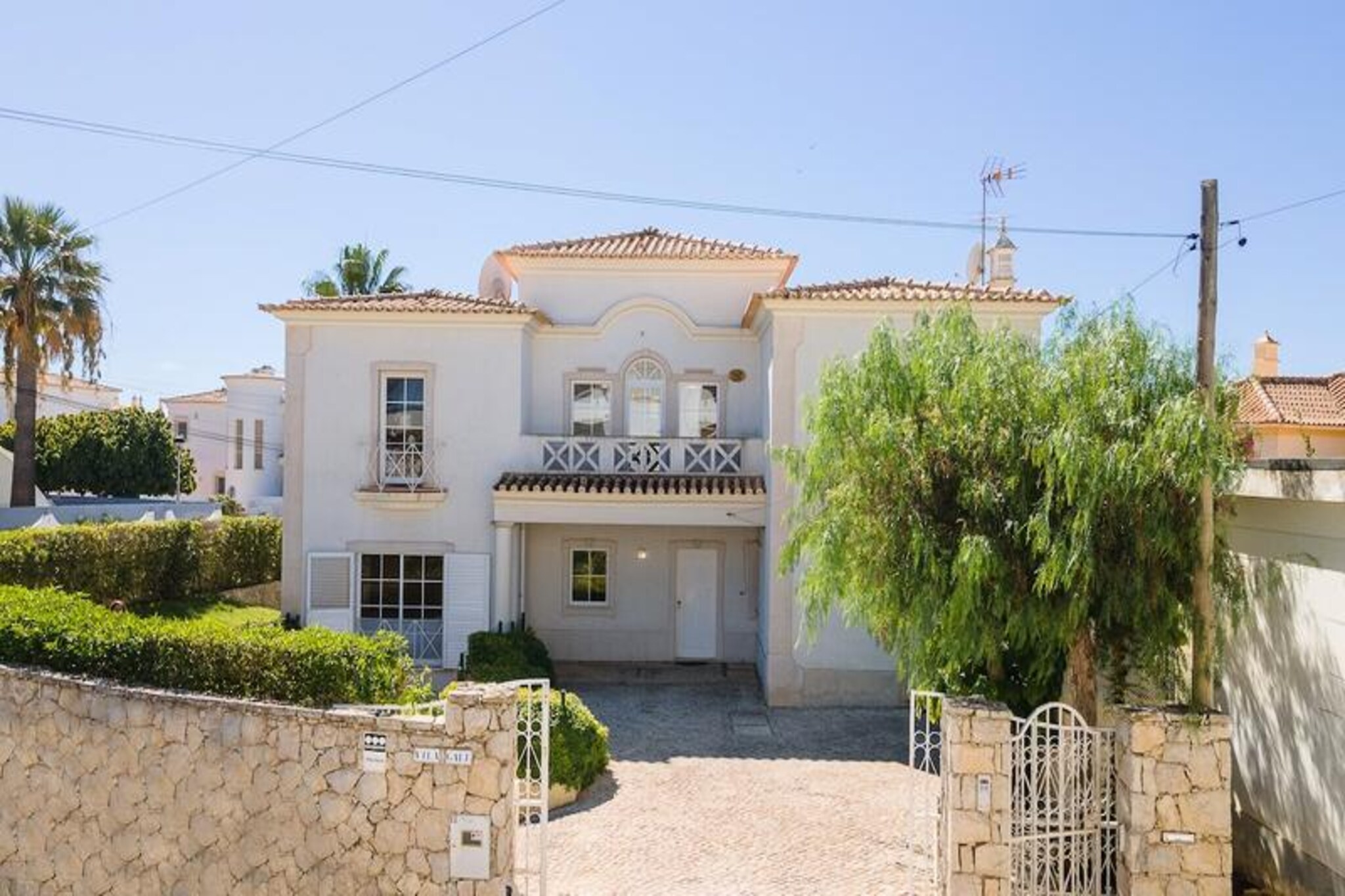 A sun-soaked retreat awaits you at this expansive 8-bedroom villa, just a short 5-minute stroll from the golden sands of Gale Beach. Wake up to the soothing sound of waves and enjoy panoramic sea views from the first-floor terrace, where the Algarve’s coastal beauty stretches as far as the eye can see. Whether you’re planning a family getaway or a group holiday, this villa offers the perfect blend of comfort and convenience in one of Portugal’s most sought-after destinations. The vibrant town of Albufeira, with its bustling shops, lively bars, and delicious restaurants, is just a 10-minute drive away, ensuring you’re never far from the action.
Inside, the villa is thoughtfully designed to accommodate up to 16 guests, with spacious bedrooms and a cozy living room equipped with air conditioning and heating for year-round comfort. The fully equipped kitchen invites you to prepare meals for your loved ones, while the large private pool offers a refreshing escape under the warm Portuguese sun. Wi-Fi is included, allowing you to stay connected as you unwind in this tranquil haven. Please note that pool heating is not available, but the Algarve’s mild climate ensures enjoyable swimming conditions throughout much of the year.
Beyond the villa, Gale Beach beckons with its soft sands and gentle waves, perfect for sunbathing or leisurely strolls. Nearby, you’ll find local restaurants serving fresh seafood and a supermarket for all your essentials, making it easy to settle into the relaxed pace of life here. For those seeking adventure, Albufeira’s marina and vibrant nightlife are just minutes away, while the region’s stunning cliffs and hidden coves invite exploration.
Whether you’re here to bask in the sun, explore the Algarve’s natural wonders, or simply enjoy quality time with loved ones, this villa promises an unforgettable escape. Book your stay and create lasting memories in this idyllic coastal retreat.