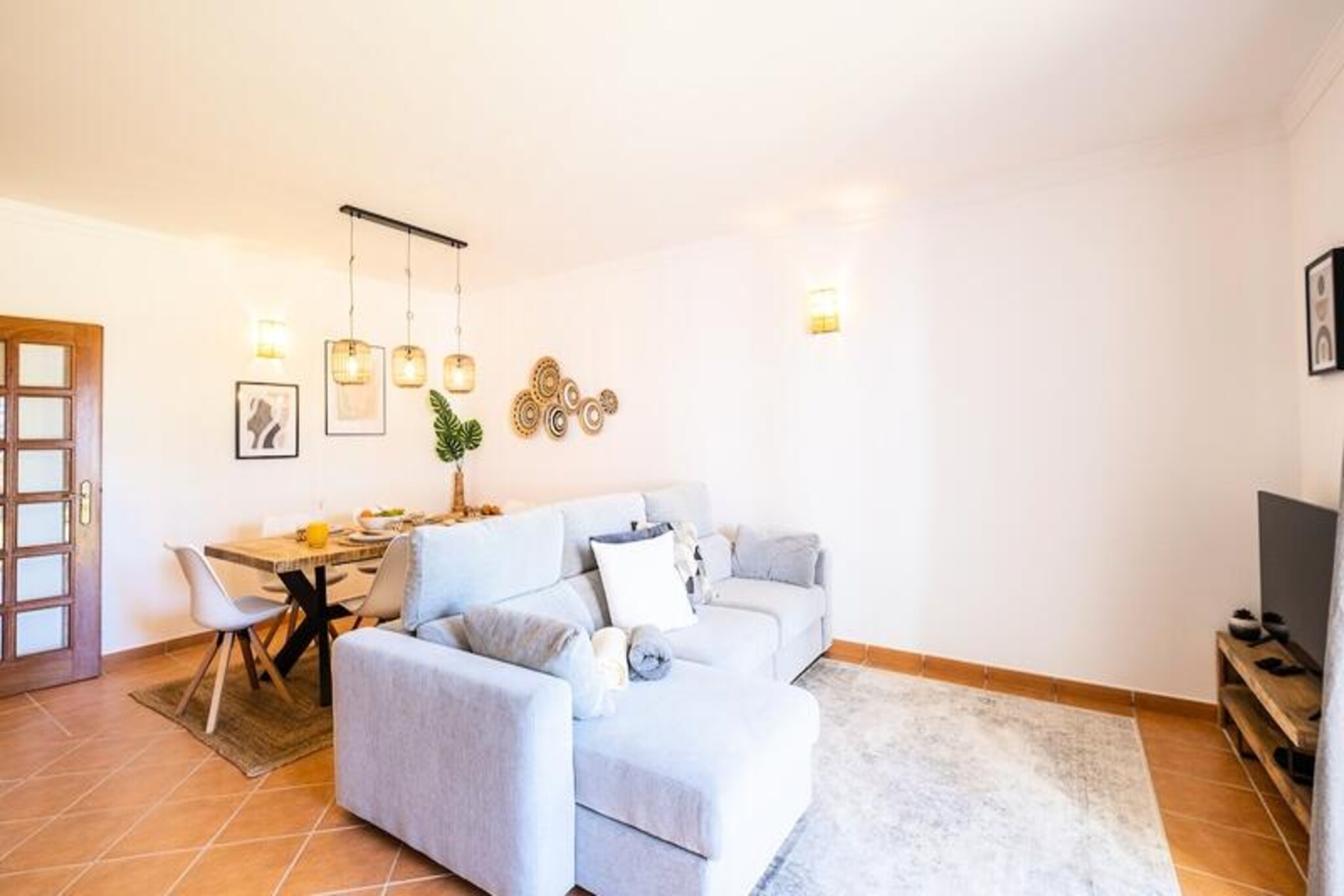 In the heart of Galé, Albufeira, Villa Jasmin offers a serene retreat just a short walk from the golden sands of Praia de São Lourenço and Praia da Galé. Surrounded by lush greenery and the gentle sound of the ocean, this villa is a perfect getaway for families or small groups seeking relaxation and sunshine in one of Portugal’s most picturesque coastal regions. The private garden and access to a shared swimming pool create an idyllic setting for unwinding after a day at the beach.
The villa comfortably accommodates up to five guests, with two beautifully appointed bedrooms on the upper floor—one with a double bed and the other with two singles that can be joined. Two modern bathrooms ensure convenience for all. On the ground floor, a fully equipped kitchen invites you to prepare delicious meals, while the spacious living room opens directly to the garden. Here, you’ll find a barbecue area and an outdoor dining table, perfect for al fresco lunches under the Algarve sun. A private pathway leads directly to the shared pool and onward to the beach, just a 15-minute stroll away.
The villa’s prime location means you’re never far from excellent local restaurants, charming cafes, and essential amenities. For those looking to explore further, Albufeira’s vibrant town center and marina are just a short drive away. Whether you’re soaking up the sun on the beach, enjoying fresh seafood at a nearby eatery, or simply relaxing in the villa’s tranquil surroundings, Villa Jasmin offers a slice of paradise.
With secure parking for two cars and the option for airport transfers, your stay is as convenient as it is comfortable. Experience the best of the Algarve with Villa Jasmin as your home base, where every moment is designed to create unforgettable memories.
