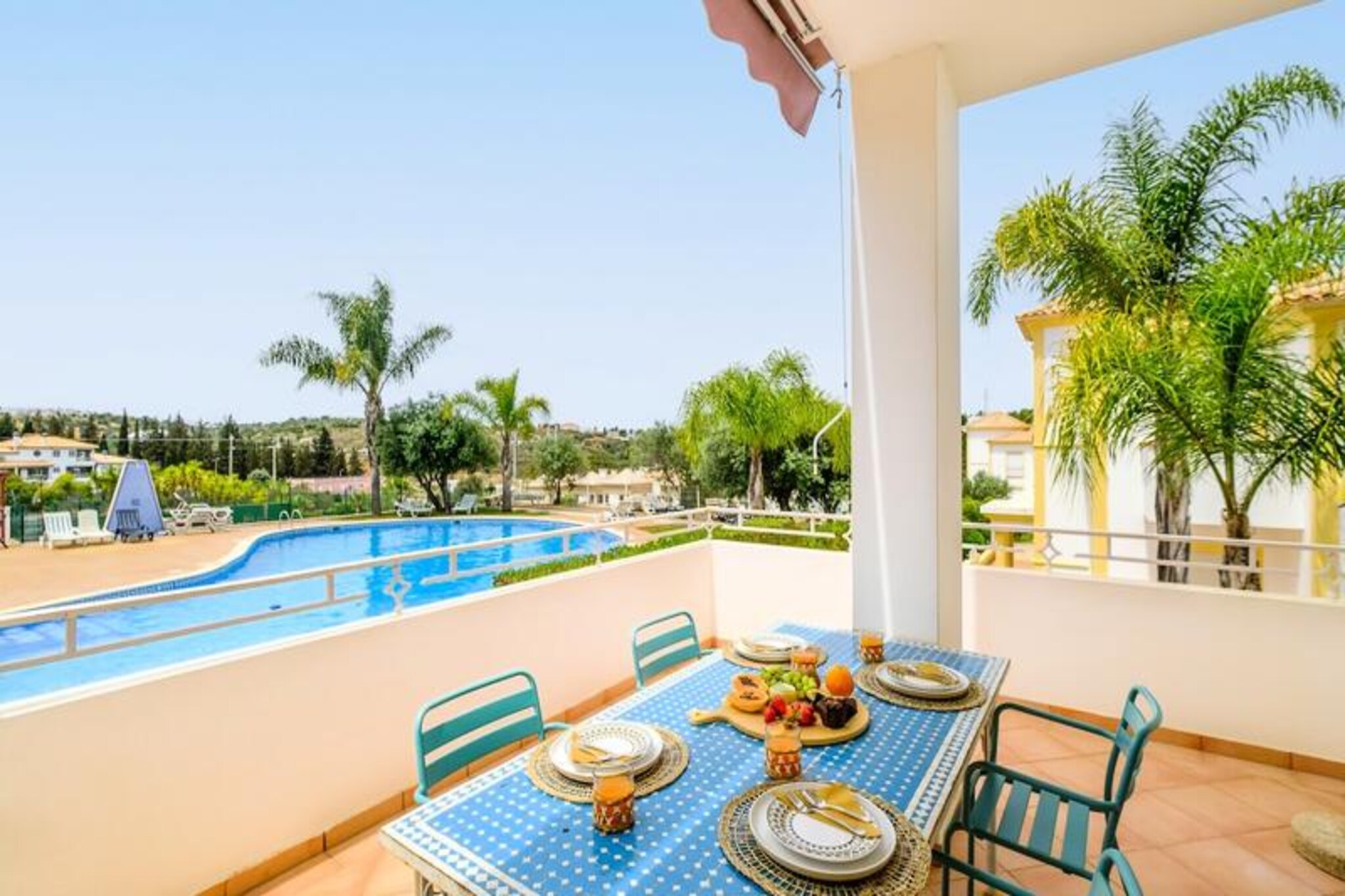 In a serene and upscale neighborhood of Portugal’s Algarve, this charming villa offers the perfect retreat for families seeking relaxation and comfort. Just a short 200-meter stroll leads you to the historic old town, where cobblestone streets are lined with vibrant bars, boutique shops, and delightful restaurants. The golden sands of the nearby beach invite you to unwind under the sun or take a refreshing dip in the Atlantic. A dedicated bike path and pedestrian walkway connect the complex to the old town, making every journey a scenic delight.
The villa is part of a well-maintained complex featuring two swimming pools—one for adults and one for children—a tennis court, and a restaurant offering reasonably priced meals. Families will find the environment safe and welcoming, with ample parking and a peaceful atmosphere away from the hustle and bustle of nightlife. The villa’s thoughtful design and amenities ensure a comfortable stay, with options to arrange airport transfers for added convenience.
Nearby, you’ll find a grocery store within a kilometer, a bus stop just 300 meters away, and a public outdoor gym only 400 meters from the property. For those who enjoy dining out, several highly recommended restaurants are within walking distance. The old town, with its rich history and lively ambiance, is less than a 25-minute walk, offering endless opportunities for exploration and discovery.
Whether you’re lounging by the pool, enjoying a game of tennis, or savoring the tranquility of the surroundings, this villa provides an idyllic setting for unforgettable family holidays. Escape to the Algarve and create cherished memories in this peaceful haven.
