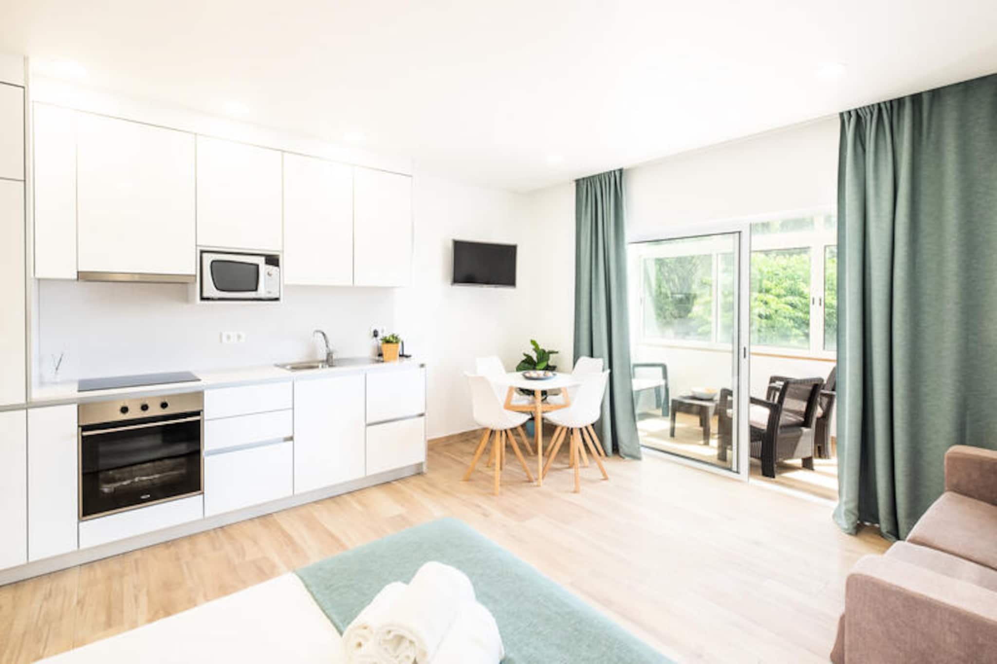 In the charming coastal town of Albufeira, this beautifully renovated studio offers a serene escape just a short stroll from the golden sands of Praia dos Pescadores. The vibrant energy of the old town, with its cobblestone streets, lively restaurants, and boutique shops, is right at your doorstep, making this the perfect retreat for couples seeking a blend of relaxation and exploration. Wake up to the gentle sounds of the ocean breeze and immerse yourself in the laid-back Algarve lifestyle. \n\nThoughtfully designed with modern decor and a cozy ambiance, the studio provides everything you need for a comfortable stay. The open-plan layout features a well-equipped kitchenette, a comfortable sleeping area, and a stylish bathroom. Large windows let in plenty of natural light, creating a bright and welcoming atmosphere. While the property does not include access to a pool, its proximity to the beach ensures you’ll have endless opportunities to soak up the sun and enjoy the crystal-clear waters of the Atlantic. \n\nBeyond the studio, Albufeira’s main attractions await. Spend your days exploring the historic old town, indulging in fresh seafood at local eateries, or embarking on a boat trip to discover the Algarve’s stunning coastline and hidden caves. For those who enjoy nightlife, the area offers a variety of bars and entertainment options to suit every taste. \n\nWhether you’re seeking a romantic getaway or a peaceful beachside retreat, this studio provides the ideal base for an unforgettable holiday in one of Portugal’s most beloved destinations.