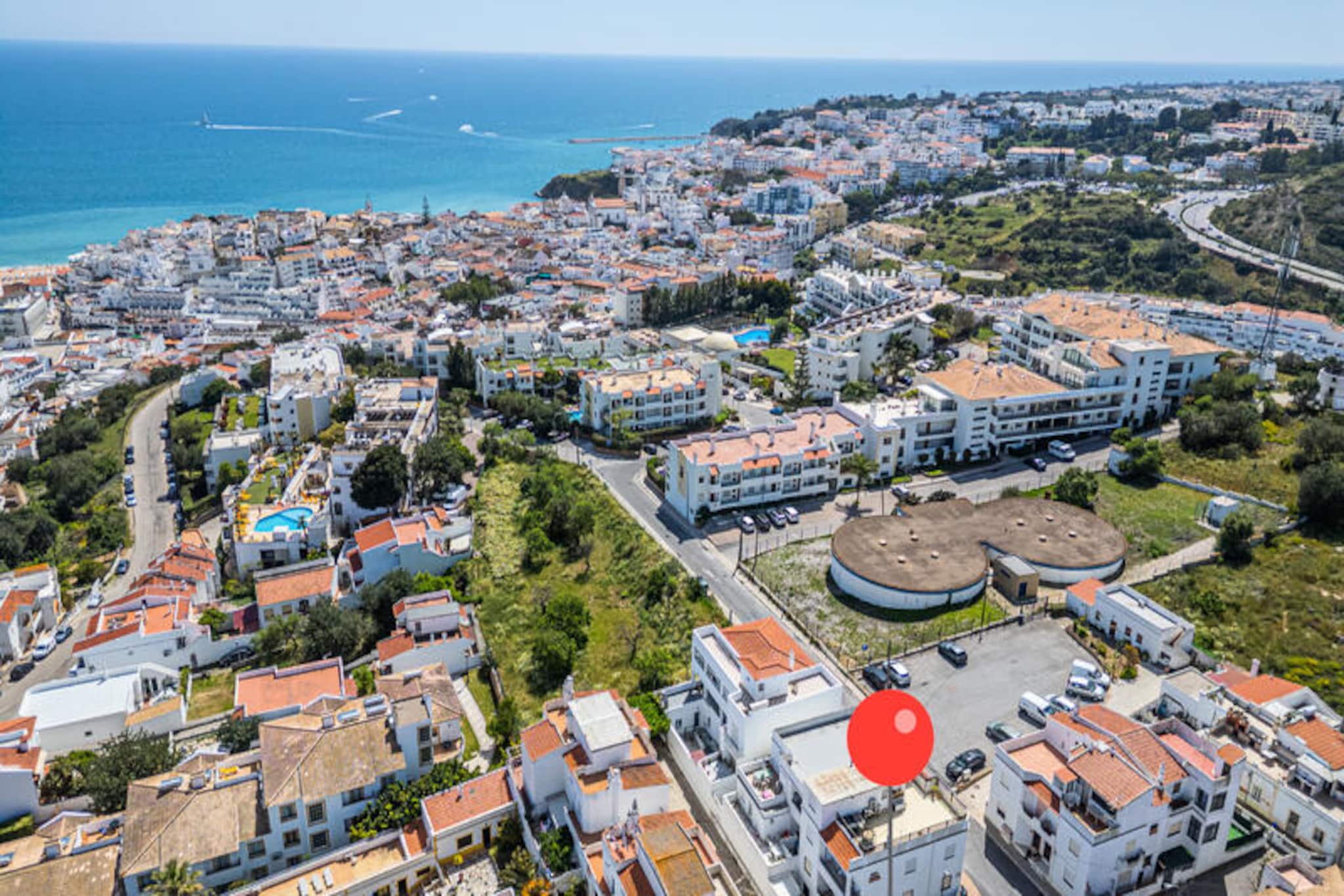 In the heart of Albufeira, where golden beaches meet vibrant city life, this inviting apartment offers the perfect blend of comfort and convenience for your Portuguese getaway. Imagine waking up to the gentle sound of waves in the distance, stepping out to explore cobblestone streets lined with local shops, and ending your day with breathtaking sunsets over the Atlantic Ocean. Whether you’re seeking relaxation or adventure, this charming retreat places you at the center of it all. \n\nDesigned with your comfort in mind, the apartment features modern amenities to ensure a hassle-free stay. The spacious living area invites you to unwind after a day of exploration, while the fully equipped kitchen allows you to prepare delicious meals with fresh local ingredients. With cozy bedrooms and tranquil surroundings, you’ll find the perfect space to recharge before diving into Albufeira’s lively atmosphere. \n\nJust steps away, you’ll discover the city’s bustling center, renowned for its vibrant nightlife, eclectic dining options, and cultural landmarks. Spend your days lounging on pristine beaches, exploring hidden coves, or indulging in water sports. For those seeking a quieter escape, the apartment’s location ensures peaceful nights away from the lively bars and clubs. \n\nWhether you’re traveling with family, friends, or as a couple, this apartment is your gateway to the authentic charm of Albufeira. Book now and create unforgettable memories in one of Portugal’s most beloved destinations.