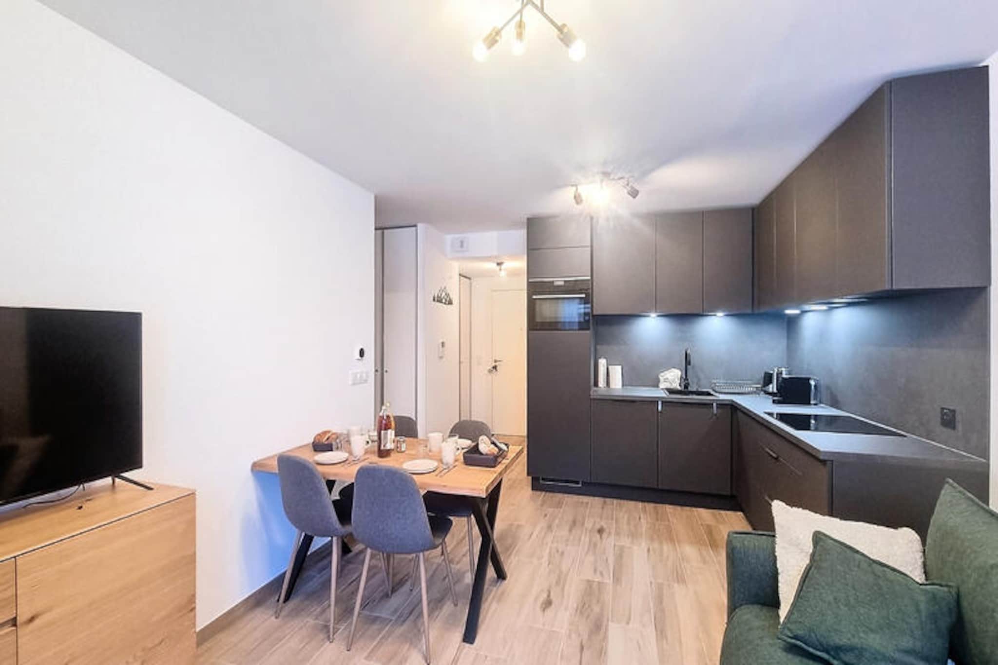 In the heart of the picturesque village of Les Gets, this delightful apartment offers a blend of modern comfort and alpine charm, making it the perfect retreat for your mountain getaway. Imagine waking up to the crisp mountain air, stepping onto your private terrace, and soaking in the serene surroundings before heading out to explore the nearby slopes or village life. With its inviting ambiance and thoughtful design, this property promises a stay filled with relaxation and adventure. \n\nSpanning 40 m², the apartment is ideal for families or small groups of friends, comfortably accommodating up to four guests. It features a cozy double bedroom and a cabin-style room with two single bunk beds, ensuring restful nights after days of exploration. The open-plan living area is equipped with a television for unwinding in the evenings, while the fully equipped kitchen—complete with a refrigerator, microwave, dishwasher, coffee maker, toaster, and kettle—provides everything you need to prepare hearty meals. The 12 m² terrace is a perfect spot for enjoying breakfast or sharing stories under the stars. Covered parking adds convenience to your stay, ensuring easy access to your adventures. \n\nLocated just 550 meters from the ski slopes and 650 meters from the village center, this apartment boasts an enviable location. Start your day with a leisurely stroll to the Chavannes cable car or explore the charming streets of Les Gets, filled with shops, restaurants, and local attractions. Whether you're here to ski, hike, or simply immerse yourself in the alpine lifestyle, everything you need is within reach. \n\nCreate unforgettable memories in this welcoming mountain retreat, where every detail has been designed to make your stay as comfortable and enjoyable as possible. Book your escape today and experience the magic of Les Gets firsthand.