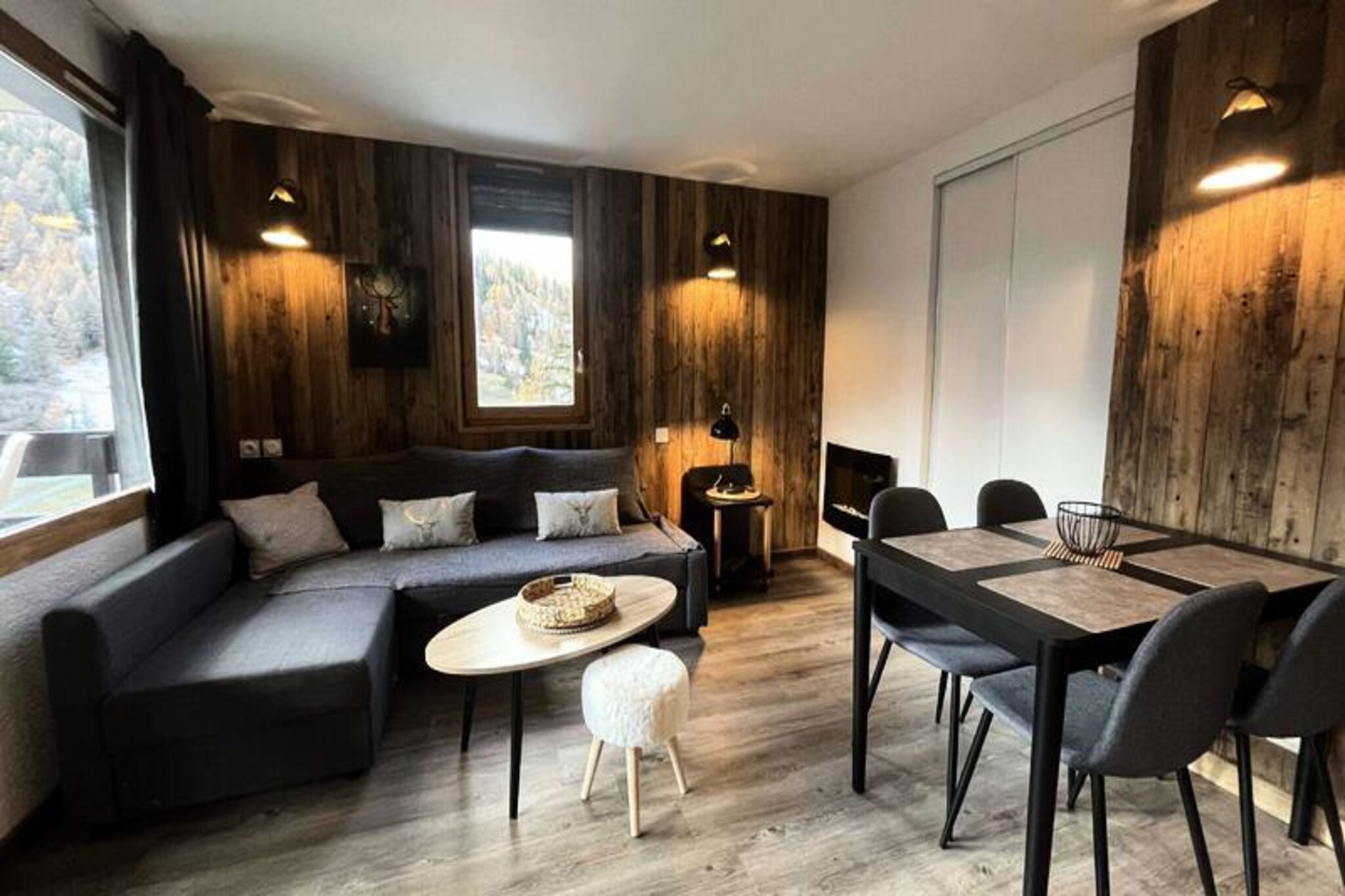 In the heart of the picturesque Plagne 1800, this charming one-bedroom apartment offers the perfect alpine retreat for families and couples alike. Surrounded by serene forests and majestic mountain views, the property exudes warmth and comfort, making it an ideal base for your next mountain escape. The south-facing balcony invites you to soak in the sunshine while admiring the breathtaking scenery, creating a tranquil space to unwind after a day of adventure. 
 
 The apartment has been thoughtfully renovated, blending contemporary design with cozy alpine charm. It comfortably accommodates up to six guests, featuring a living room with a sofa bed and a television, as well as a bedroom with double bunk beds that provide a snug retreat. The open kitchen is fully equipped with modern appliances, including a refrigerator, ceramic hob, microwave, and even a raclette grill for a true taste of the Alps. Additional amenities such as a ski locker and covered parking ensure a hassle-free stay.
 
 Guests also have access to the wellness area at La Plagne Lauzes, which includes a heated outdoor pool, sauna, and squash court, perfect for relaxation and rejuvenation after a day on the slopes. The family-friendly resort of Plagne 1800 offers a peaceful atmosphere with nearby shops and free shuttles connecting you to Plagne Centre, making it easy to explore the wider area.
 
 Whether you’re here to ski, hike, or simply relax, this delightful apartment provides everything you need for an unforgettable alpine getaway. From its convenient location to its welcoming ambiance, it’s the perfect choice for creating cherished mountain memories.