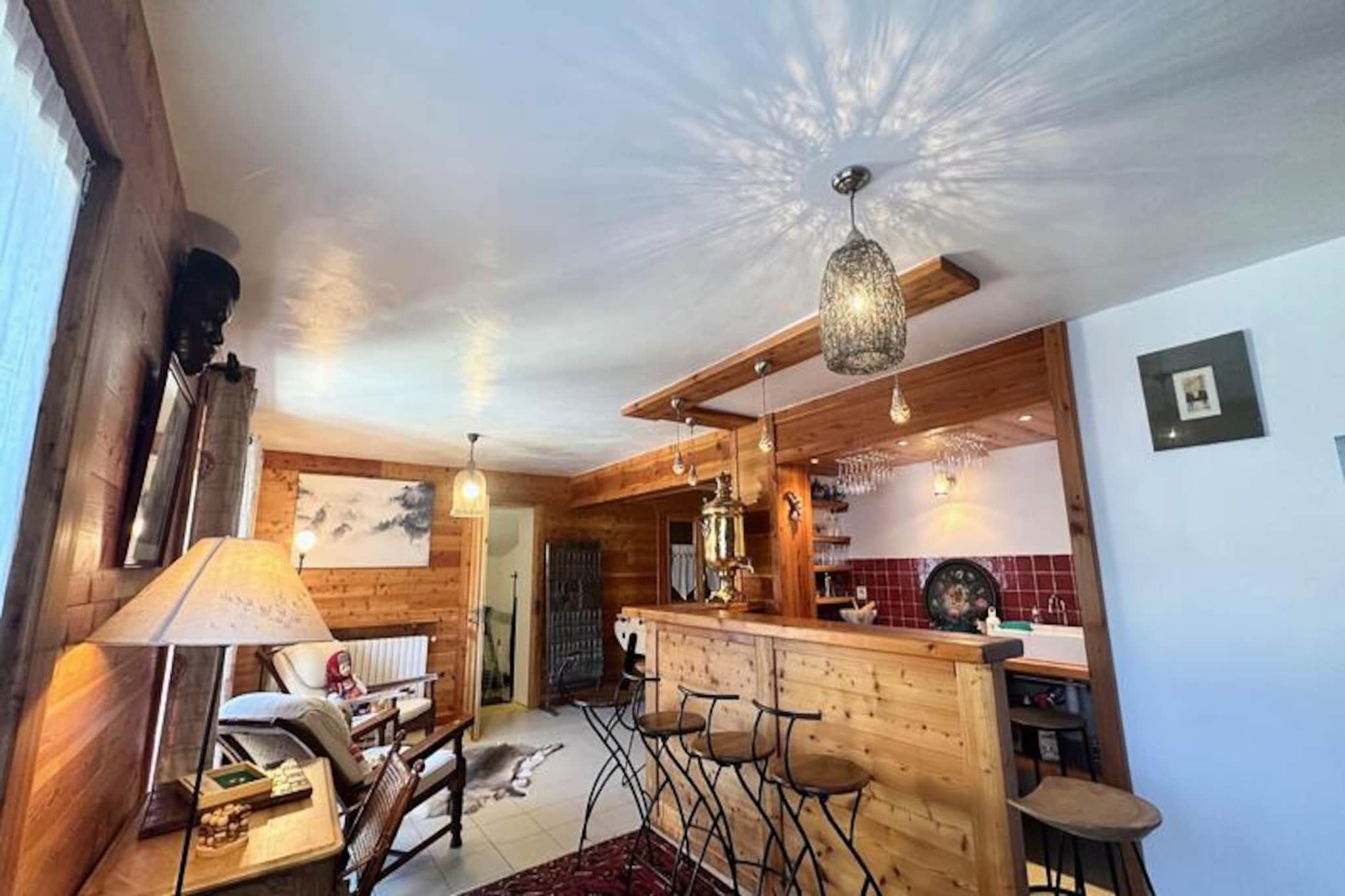 Perched in the picturesque village of Sainte Catherine, just a short 10-minute drive from Vars les Claux, this stunning chalet offers a perfect blend of alpine charm and modern comfort. With free shuttles running regularly to key points in the resort, families can enjoy hassle-free access to the slopes without the need to walk long distances with children. The chalet’s south-facing orientation ensures sunshine floods the interiors throughout the day, creating a warm and inviting atmosphere against the breathtaking backdrop of the Écrins massif and Olympic slopes. \n\nDesigned with both relaxation and entertainment in mind, the chalet features a spacious entrance hall ideal for storing ski gear, boots, and mountain bikes. The ground floor boasts a ski room and a social area equipped with a kitchenette, bar, table football, sauna, and gym—perfect for unwinding after a day of adventure. The main floor is home to a luminous living area with a central fireplace, a fully equipped open-plan kitchen, and a cozy double bedroom with an en-suite shower room. Upstairs, two large double bedrooms, a charming children’s room with trundle beds and a crib, and additional bathroom facilities provide ample space for families to relax in comfort. \n\nSafety is a priority, with a removable gate on the staircase to ensure peace of mind for parents. Whether you’re soaking in the sauna, staying active in the gym, or enjoying the warm ambiance of the fireplace, this chalet promises unforgettable moments in an enchanting alpine setting. With two private parking spaces and a dedicated ski room, convenience is at your fingertips. \n\nExperience the magic of the mountains in this exceptional family retreat—contact us today to plan your stay and create lasting memories in the heart of the Alps.