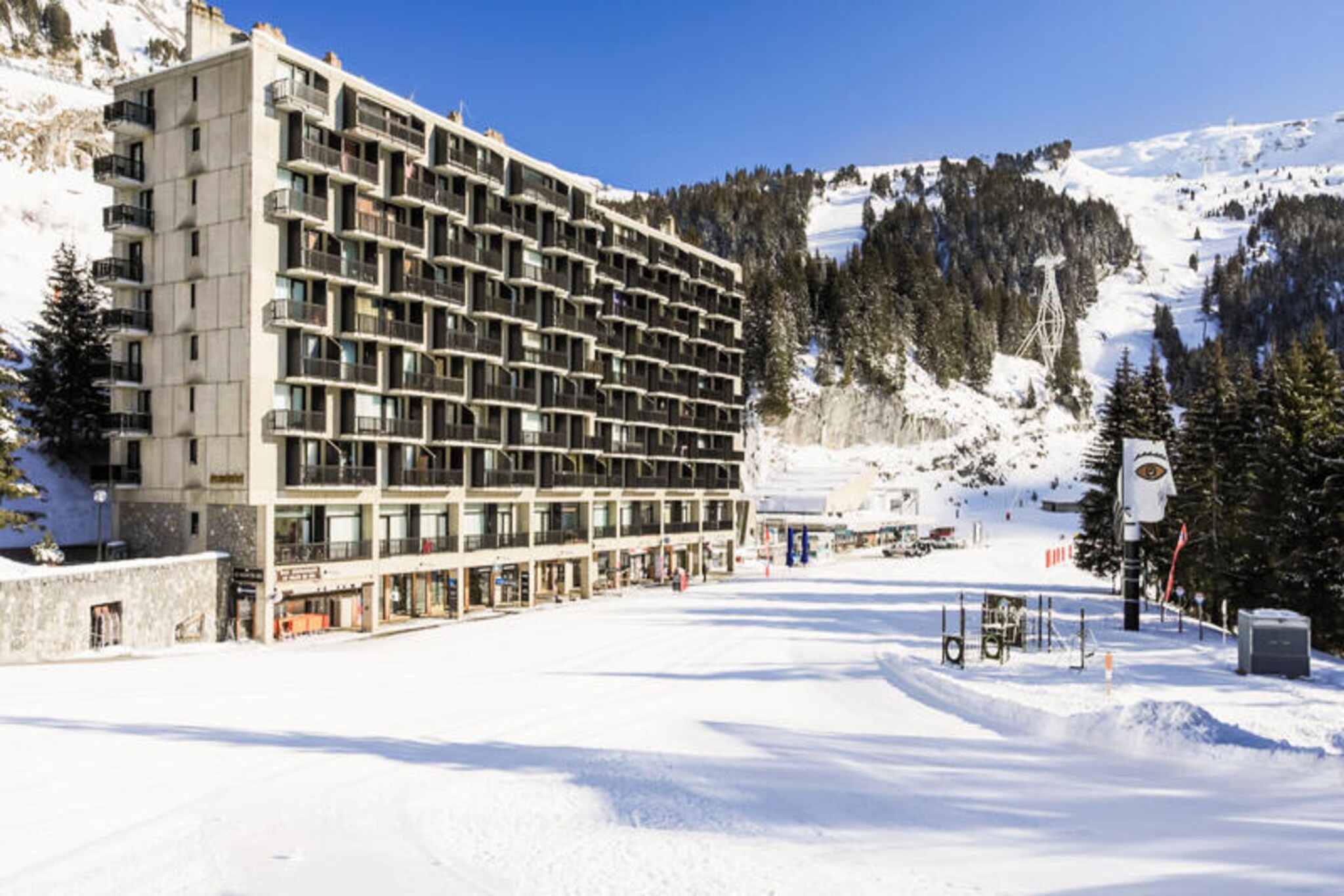 In the heart of the picturesque Flaine resort, the Aldébaran Residence offers a cozy retreat in the vibrant Forum district, the beating heart of this alpine destination. Just steps away from the Flaine Forum shopping mall, you’ll find yourself surrounded by lively bars, inviting restaurants, and a wealth of activities to immerse yourself in the mountain spirit. Whether you’re here for the snow or the summer sun, this location ensures you’re at the center of it all. 
 
 This charming 28 m² apartment is thoughtfully designed to maximize comfort and functionality. Located on the 5th floor, it features a bright living room with a standard sofa and a fold-out sofa bed, perfect for relaxing after a day of adventure. The open-plan kitchen is equipped for preparing meals to enjoy in the dining area, which comfortably seats five. A cozy sleeping alcove with bunk beds adds a touch of alpine charm, while the private balcony invites you to soak in the crisp mountain air and stunning views. 
 
 For ski enthusiasts, the residence is ideally situated at the foot of the slopes, with the Flaine Forum ESF meeting point and the Télébennes cable car just a few steps away. This prime location allows you to hit the slopes effortlessly and explore the expansive ski area. In the warmer months, the resort transforms into a haven for hikers and nature lovers, with trails and activities that showcase the breathtaking beauty of the Alps. 
 
 Whether you’re seeking thrilling outdoor adventures or a relaxing escape in a lively alpine village, the Aldébaran Residence provides the perfect base for an unforgettable holiday in Flaine. Book your stay and experience the magic of the mountains.