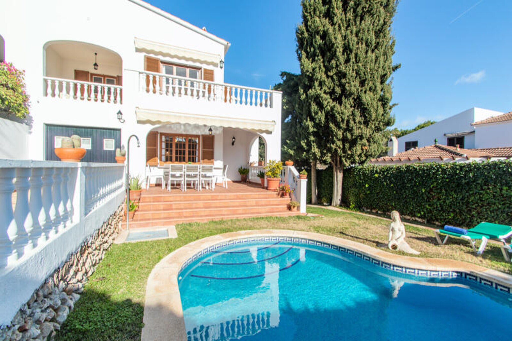 Surrounded by the serene beauty of Cala Galdana, this exquisite villa offers a tranquil escape for families and friends seeking the perfect Mediterranean retreat. With its lush garden views and a private pool shimmering under the Menorcan sun, this property invites you to relax and unwind in one of Spain’s most picturesque coastal destinations. Just a short stroll from the vibrant heart of Cala Galdana, you’ll find yourself immersed in the charm of this family-friendly area, where natural beauty meets modern convenience. \n\nSpanning an impressive 232 m², the villa boasts six spacious bedrooms, comfortably accommodating up to ten guests. The interior is both welcoming and functional, featuring a separate gas kitchen equipped with everything you need to prepare delicious meals, from a refrigerator and oven to a coffee maker and juicer. The living spaces are thoughtfully designed with modern amenities, including Wi-Fi, satellite TV, air conditioning, and a cozy fireplace for cooler evenings. Outside, the fenced garden, terrace, and barbecue area provide the perfect setting for al fresco dining, while the private pool offers a refreshing escape from the summer heat.\n\nCala Galdana’s sandy beach is just 700 meters away, offering crystal-clear waters ideal for swimming and sunbathing. For those eager to explore, the stunning coves of Cala Mitjana, Cala Macarella, and Cala Macarelleta are within a short drive, each showcasing the island’s natural splendor. Nearby, you’ll also find charming towns like Ferreries, Ciutadella, and Mahon, where you can discover local culture and cuisine. With restaurants, cafes, and supermarkets just steps away, everything you need is at your fingertips.\n\nWhether you’re seeking relaxation by the pool, adventures along the coast, or evenings spent under the stars, this villa in Cala Galdana promises an unforgettable holiday experience. Let the gentle sea breeze and the beauty of Menorca create memories to last a lifetime.