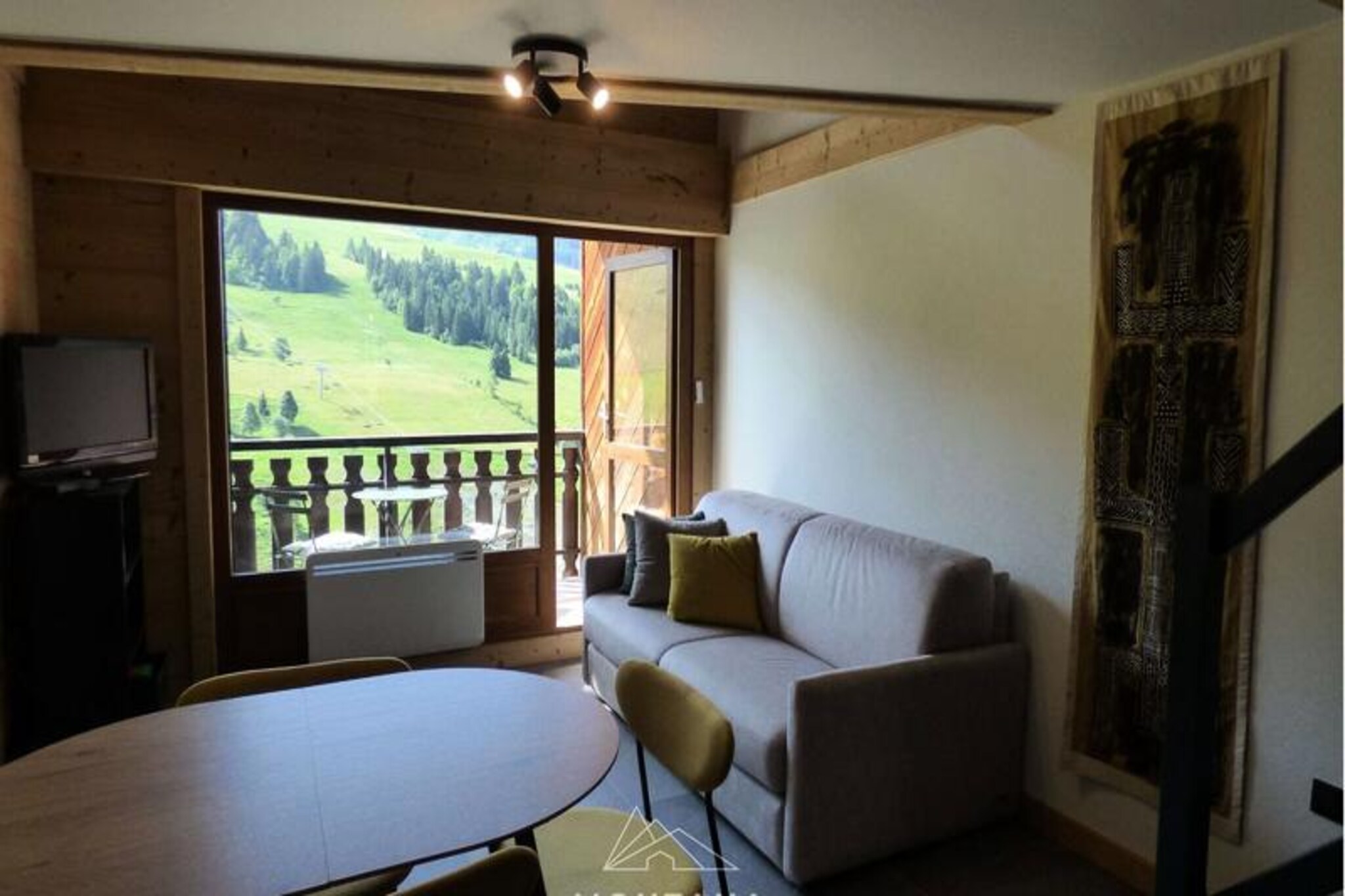 High above the picturesque village of Chinaillon, this newly renovated apartment offers a serene alpine escape with stunning views of the iconic Lachat peak. Whether you're planning a winter ski holiday or a summer retreat in the French Alps, this property combines modern comfort with authentic mountain charm to create an unforgettable experience. Imagine sipping your morning coffee on the south-facing balcony, soaking in the crisp mountain air and breathtaking scenery that stretches as far as the eye can see. Located in the prestigious Le Chalet de Lessy B residence, this apartment is your gateway to adventure and relaxation. \n\nDesigned to accommodate up to six guests, the apartment features a thoughtfully arranged layout with a fully equipped kitchen that opens into a cozy living room. The living area includes a brand-new 140cm sofa bed and a flat-screen TV for unwinding after a day of exploration. Upstairs, you'll find a comfortable bedroom with a 140cm bed and a mezzanine equipped with another new 140cm sofa bed. Two modern bathrooms with showers and toilets ensure convenience for all guests. Please note that sheets and towels are not provided, and a tourist tax applies to adults aged 18 and older. \n\nSituated just 450 meters from the village shops and 900 meters from the ski lifts, the location is ideal for those eager to hit the slopes or explore the charming streets of Chinaillon. In the warmer months, the area transforms into a haven for hikers and nature lovers, with trails that lead to lush meadows and panoramic viewpoints. The nearby village offers a selection of restaurants, boutiques, and local markets, perfect for immersing yourself in the region's culture and cuisine. \n\nWhether you're seeking thrilling outdoor adventures or peaceful moments surrounded by alpine beauty, this apartment in Chinaillon is the perfect base for your next mountain getaway. Book now and create lasting memories in the heart of the French Alps.