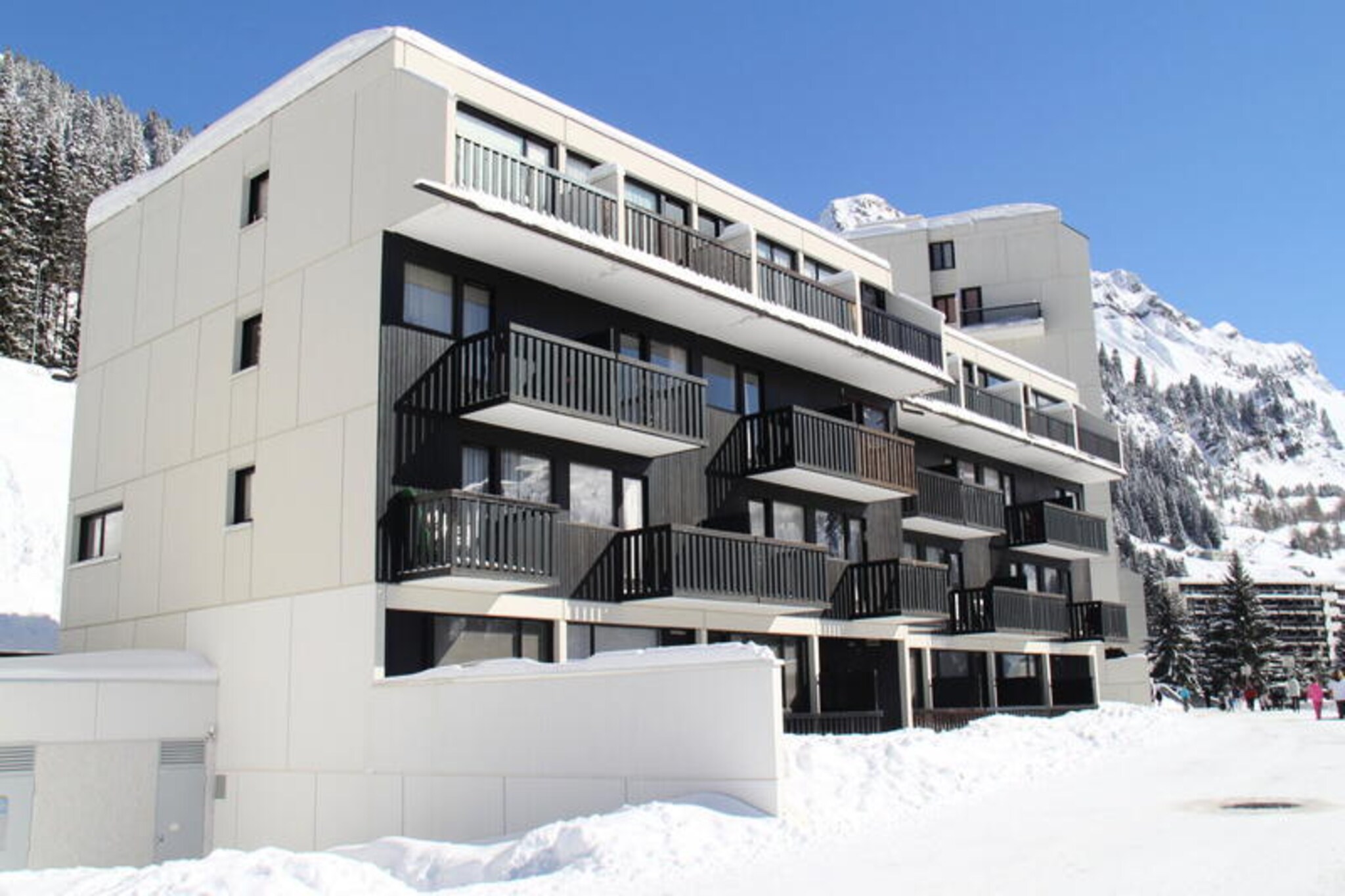 High above the serene landscapes of the Haute-Savoie region, this charming apartment in the Flaine Forêt district invites you to immerse yourself in the beauty of the French Alps. Whether you're chasing powdery slopes in winter or exploring vibrant alpine trails in summer, this residence offers a perfect blend of comfort and convenience just 250 meters from the ski school meeting points and lifts. The south-facing balcony provides a tranquil spot to soak in the sunshine and admire the surrounding peaks, setting the tone for a memorable mountain getaway. \n\nDesigned to accommodate up to six guests, the apartment boasts a thoughtfully arranged layout with a cozy bedroom featuring a double bed, a set of bunk beds in the entrance, and a double sofa bed in the living room. The open-plan kitchenette is equipped with ceramic hobs, a combination oven, and a dishwasher, making it easy to prepare hearty meals after a day of adventure. Modern amenities such as a television and a bathroom with a bathtub ensure a relaxing stay, while the ski locker adds practicality for winter sports enthusiasts. Please note that bed linen and towels are not provided, and the upper bunk is not suitable for children under six years old. \n\nFlaine Forêt is perfectly positioned for both convenience and exploration. Shops, restaurants, and essential services are just a short stroll away, while the nearby slopes offer direct access to the renowned Grand Massif ski area. In summer, the included Flaine Summer Pass unlocks a world of activities, from hiking and mountain biking to cultural events and family-friendly fun. \n\nWhether you're seeking thrilling descents, peaceful alpine walks, or simply a cozy retreat to unwind, this residence is your gateway to the enchanting charm of Flaine. Let the crisp mountain air and breathtaking vistas inspire your next adventure in the heart of the Alps.