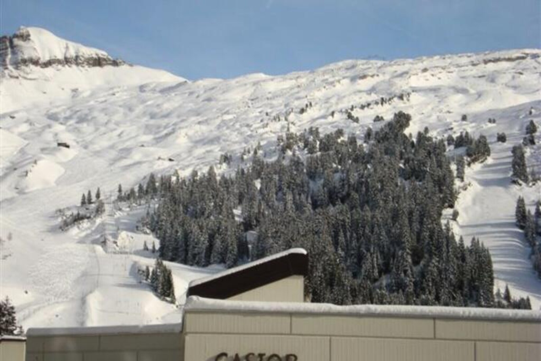 In the serene Flaine Forêt district, this charming studio offers a delightful alpine escape just 150 meters from the slopes and ski school meeting points. Perfectly situated for both winter sports enthusiasts and summer adventurers, the residence combines convenience with comfort, ensuring an unforgettable stay in the heart of the French Alps. From its south-facing balcony on the third floor, soak in the crisp mountain air and enjoy the tranquil views that make Flaine a beloved destination year-round. \n\nThe renovated 25 m² studio is thoughtfully equipped for up to four guests, making it ideal for couples or small families. The entrance features a set of bunk beds, while the living room offers a cozy double sofa bed. Modern amenities include a flat-screen TV, DVD player, and a fully equipped kitchenette with electric burners, a dishwasher, oven, microwave, and Nespresso coffee maker. The bathroom includes a bathtub, and there’s a separate toilet for added convenience. Ski lockers are provided for easy storage, and the property maintains a smoke-free and pet-free environment, ensuring a clean and comfortable stay. Please note that bed linen and towels are not included, and the top bunk is not suitable for children under six years old.\n\nBeyond the residence, Flaine offers a wealth of activities and attractions. In winter, guests can explore the expansive Grand Massif ski area, renowned for its pristine slopes and breathtaking scenery. In summer, the included Flaine Summer Pass unlocks numerous activities, from hiking and mountain biking to cultural events and outdoor adventures. Nearby shops and restaurants ensure all essentials are within easy reach, while the charm of the Flaine Forêt district provides a peaceful retreat after a day of exploration.\n\nWhether you’re seeking thrilling days on the slopes or tranquil evenings under the alpine sky, this studio is your gateway to the wonders of Flaine. Create lasting memories in a destination that perfectly blends natural beauty, outdoor excitement, and modern comfort.