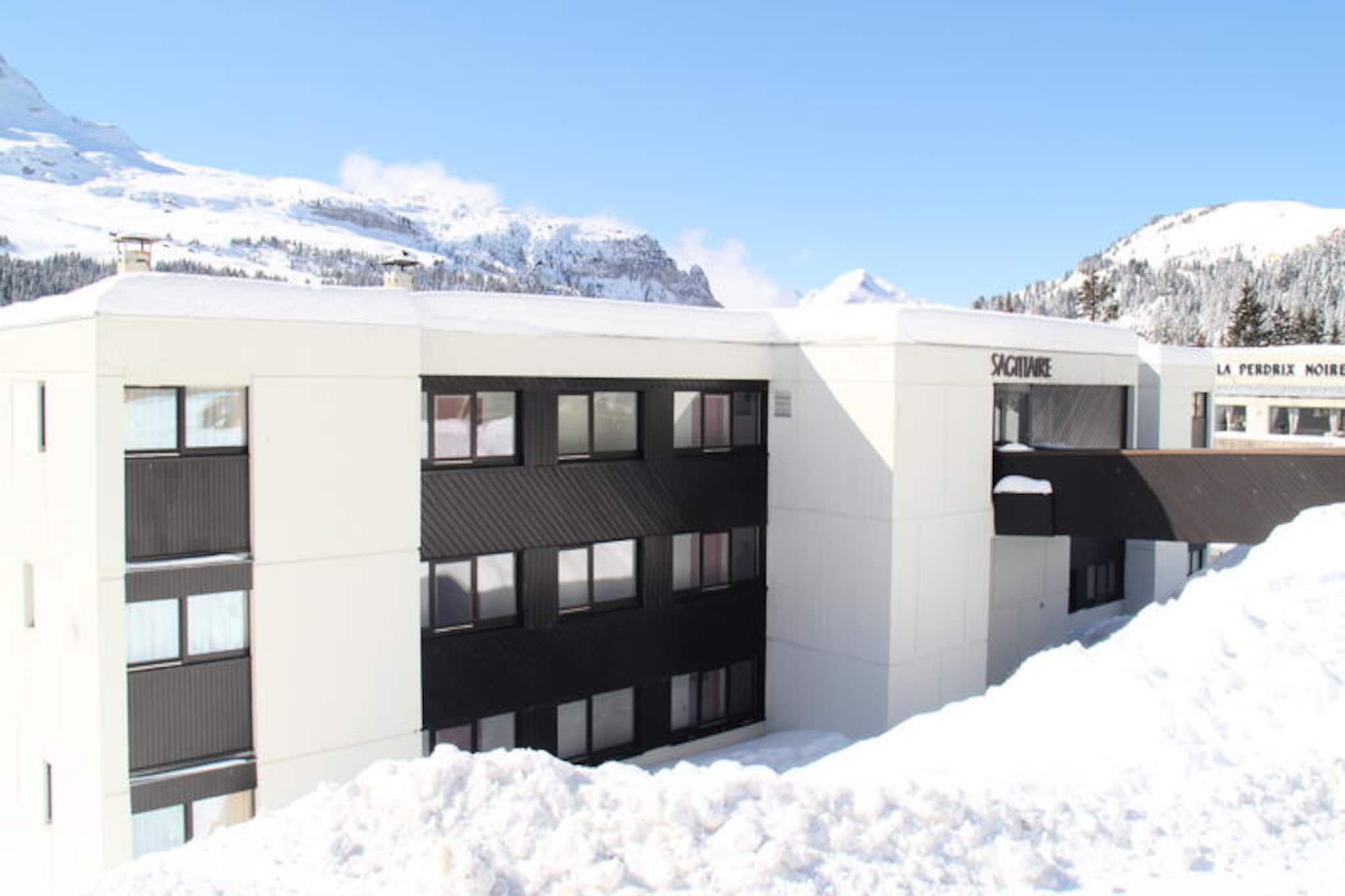 High above the serene landscapes of Flaine, this charming studio apartment in the Flaine Forêt district offers a delightful alpine retreat for travelers seeking both comfort and convenience. With the slopes and ski school meeting points just 250 meters away, and shops within easy reach, this cozy residence is perfectly situated for a memorable mountain getaway. The nearby bus stop, only 20 meters from the building, ensures effortless access to the surrounding area, making it an ideal base for exploring the wonders of the French Alps. \n\nStep inside this fully renovated 25 m² south-facing studio, where parquet floors and warm decor create a welcoming atmosphere. Designed to accommodate up to five guests, the apartment features a cabin with a double bed and a mezzanine single bed, as well as a living room with a comfortable double sofa bed. Modern amenities include a flat-screen TV, DVD, CD, and USB player, ensuring entertainment for all. The kitchenette is equipped with an oven, microwave, and dishwasher, making meal preparation a breeze, while the bathroom with a bathtub and separate toilet adds to the convenience. A large closet in the entrance hall provides ample storage space, and the south-facing balcony offers stunning views of the surrounding peaks. \n\nBeyond the apartment, Flaine offers a wealth of activities and attractions. In winter, enjoy skiing on pristine slopes and après-ski delights in the village. During the summer season, the included Flaine Summer Pass unlocks a variety of activities, from hiking and mountain biking to cultural events and nature excursions. With ski lockers and thoughtful amenities like duvets provided, this non-smoking apartment ensures a comfortable stay year-round. \n\nWhether you’re drawn to the thrill of winter sports or the tranquility of summer in the mountains, this residence combines practicality, charm, and unbeatable proximity to the best of Flaine. Create unforgettable memories in this delightful alpine haven.