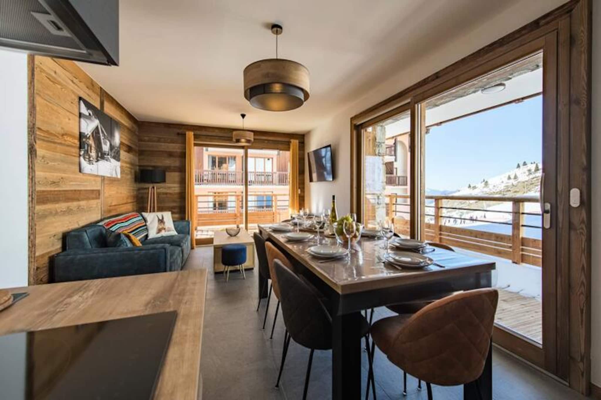 High above the picturesque village of Valmeinier, this elegant mountain apartment invites you to experience the perfect blend of alpine charm and modern luxury. At an altitude of 1950m, you’ll find yourself immersed in breathtaking scenery, with the convenience of ski-in, ski-out access to the pristine slopes of the Maurienne Valley. Whether you’re here for winter sports or summer hikes, this residence promises an unforgettable escape.
Step inside to discover a warm and contemporary space designed for relaxation and comfort. The living area, with its cozy seating and dining space, opens onto a spacious 21m² northwest-facing balcony, perfect for soaking in the mountain views. The fully equipped kitchen features top-tier appliances, including an induction hob, oven, microwave, and Nespresso coffee maker, ensuring you have everything you need for a home-cooked meal. With two double bedrooms, a sleeping area with three single beds, and two modern bathrooms, this apartment comfortably accommodates up to seven guests, making it ideal for families or groups of friends. Additional amenities such as a washing machine, dryer, ski locker with boot dryer, and private parking with an EV charging station add to the convenience.
Located at the heart of Valmeinier 1950, you’re just steps away from charming shops, inviting restaurants, and essential services. In summer, explore the nearby hiking trails or take a refreshing dip in the municipal swimming pool. For winter visitors, ski passes and lessons can be arranged and delivered directly to your residence, ensuring a seamless holiday experience.
Choose this exceptional apartment for your next mountain getaway and create lasting memories surrounded by the beauty of the French Alps.