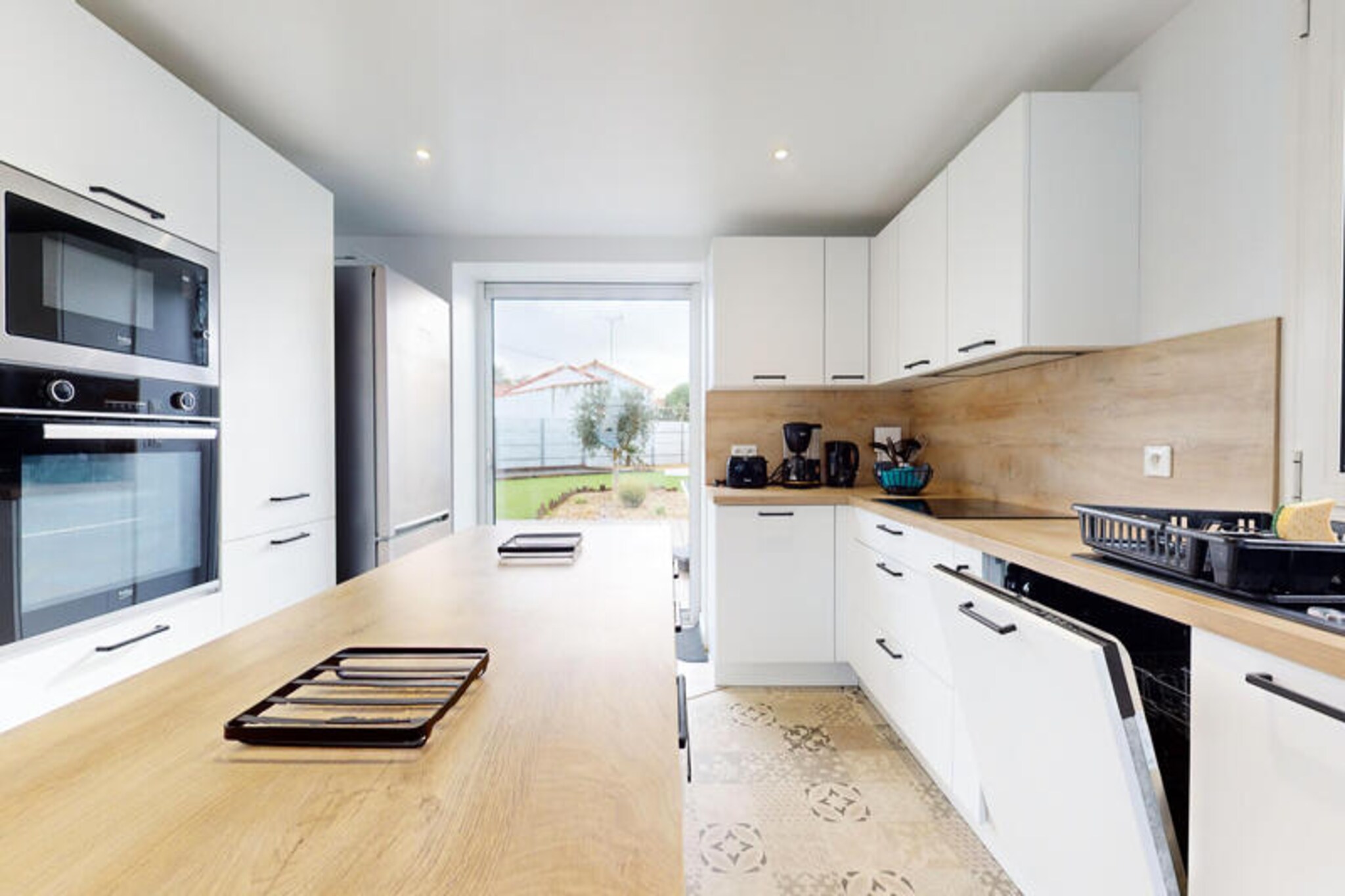 Imagine waking up to the soothing sound of waves and the scent of salty sea air at Villa Le Chant des Vagues in Saint-Jean-de-Monts. Just 300 meters from the golden sands of the Atlantic, this charming 1950s villa, fully renovated, offers the perfect blend of vintage charm and modern comfort. Whether you're planning a getaway with family or a group of friends, this spacious retreat accommodates up to 15 guests, ensuring everyone has room to relax and unwind.
The villa is thoughtfully divided into two accommodations. The ground floor features a bright and airy living room with a fully equipped open kitchen, perfect for preparing meals to enjoy on the large terrace. Three cozy bedrooms, including one with bunk beds, make it ideal for families. Upstairs, the second accommodation boasts a separate entrance, a sunlit veranda, and a well-equipped kitchen. With two additional bedrooms and a sofa bed in the living room, this space offers both privacy and comfort.
Outside, a sprawling 700 m² private garden invites you to bask in the sun, enjoy al fresco meals, or simply relax while the kids play. The nearby bike path makes exploring the picturesque surroundings a breeze, while free Wi-Fi ensures you stay connected. Pets are welcome, so no family member gets left behind.
Located just steps from the beach and a short stroll from local shops, bakeries, and the bustling market, Villa Le Chant des Vagues is perfectly positioned for a car-free holiday. Whether you're savoring fresh seafood, cycling along coastal paths, or simply soaking up the sun, this villa promises an unforgettable seaside escape. Book your stay today and let the rhythm of the waves set the tone for your perfect vacation.