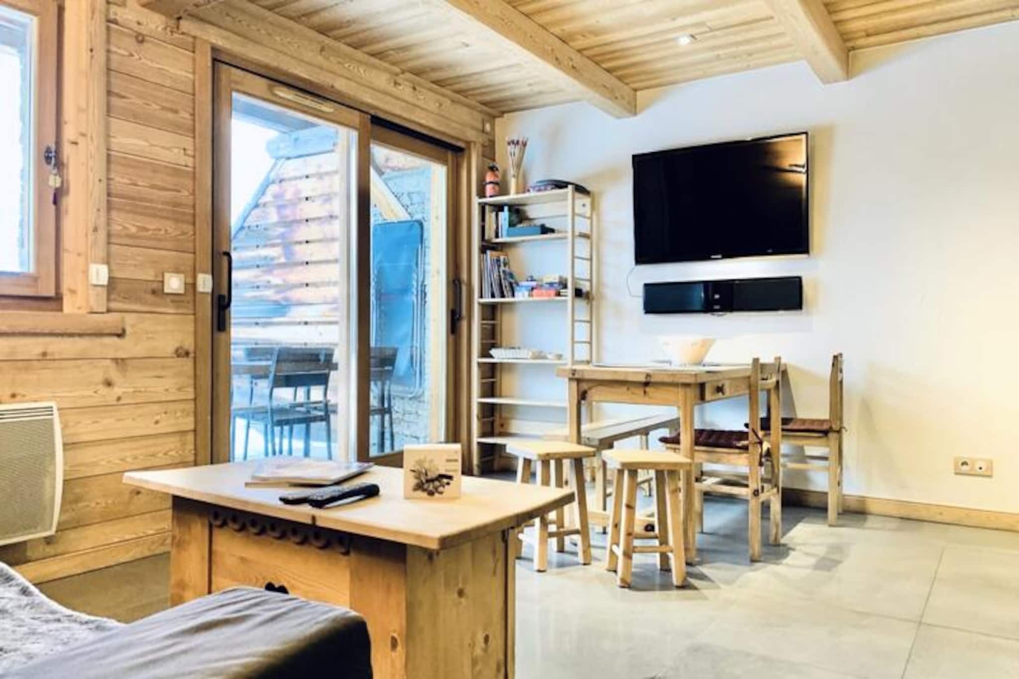 High above the valley floor, where the sun graces the peaks of the Grandes Rousses, this charming apartment in Alpe d'Huez invites you to experience the magic of the French Alps. With its prime location in the Quartier du Vieil Alpe, you’re just steps away from ski lifts, the Tourist Office, and the vibrant heart of the resort. Whether it’s the thrill of carving through fresh powder or the serenity of a summer mountain escape, this residence offers the perfect base for your alpine adventures. 
 
 Inside, the apartment combines modern comfort with alpine charm. The cozy living room is perfect for unwinding after a day on the slopes, while the fully equipped kitchen makes preparing meals a delight. The sleeping arrangements are thoughtfully designed, featuring a master bedroom with a double bed and a second TV, a cabin room with a double bed and a single bunk above, and a sleeping alcove with bunk beds. A spacious bathroom with a bathtub ensures relaxation, and the private terrace, bathed in sunlight, is ideal for soaking in the mountain air. Additional amenities include a flat-screen TV, raclette and fondue sets, and a secure garage with an electric charging station. 
 
 Beyond the apartment, the location is unbeatable. Ski enthusiasts will appreciate the direct access to lifts and the ski room with boot warmers, while cyclists and drivers benefit from the secure double garage. The free shuttle service makes exploring the resort effortless, and the nearby PAGANON stop connects you to Bourg d’Oisans. Whether you’re here to ski, cycle, or simply relax, Alpe d’Huez offers something for everyone. 
 
 Choose this apartment for its unbeatable location, thoughtful amenities, and the promise of unforgettable memories in one of the Alps’ most iconic destinations.